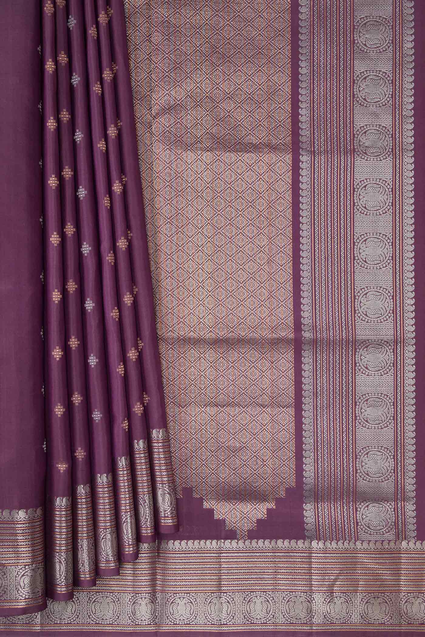 Pleats and pallu of Purple Dual Tone Soft Silk Saree with Zari Butta on the body and Zari Border. 