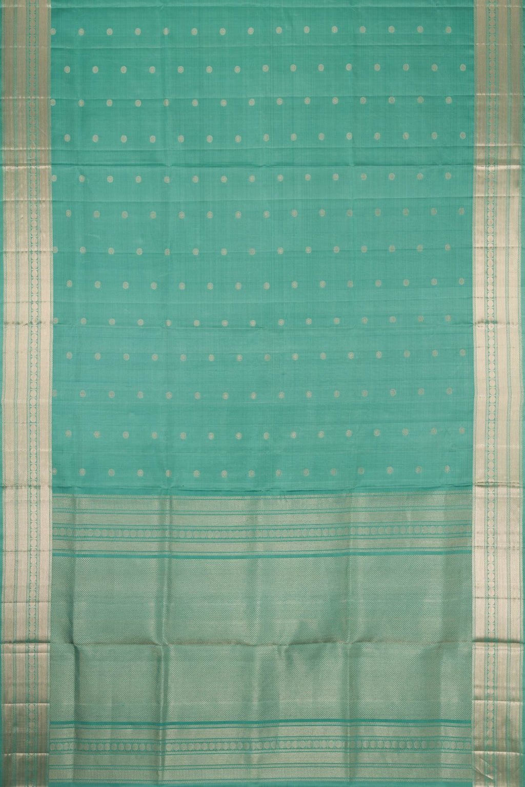 Flat view of Green Dual Tone Soft Silk Saree with Zari Butta on the body and Zari Border. 