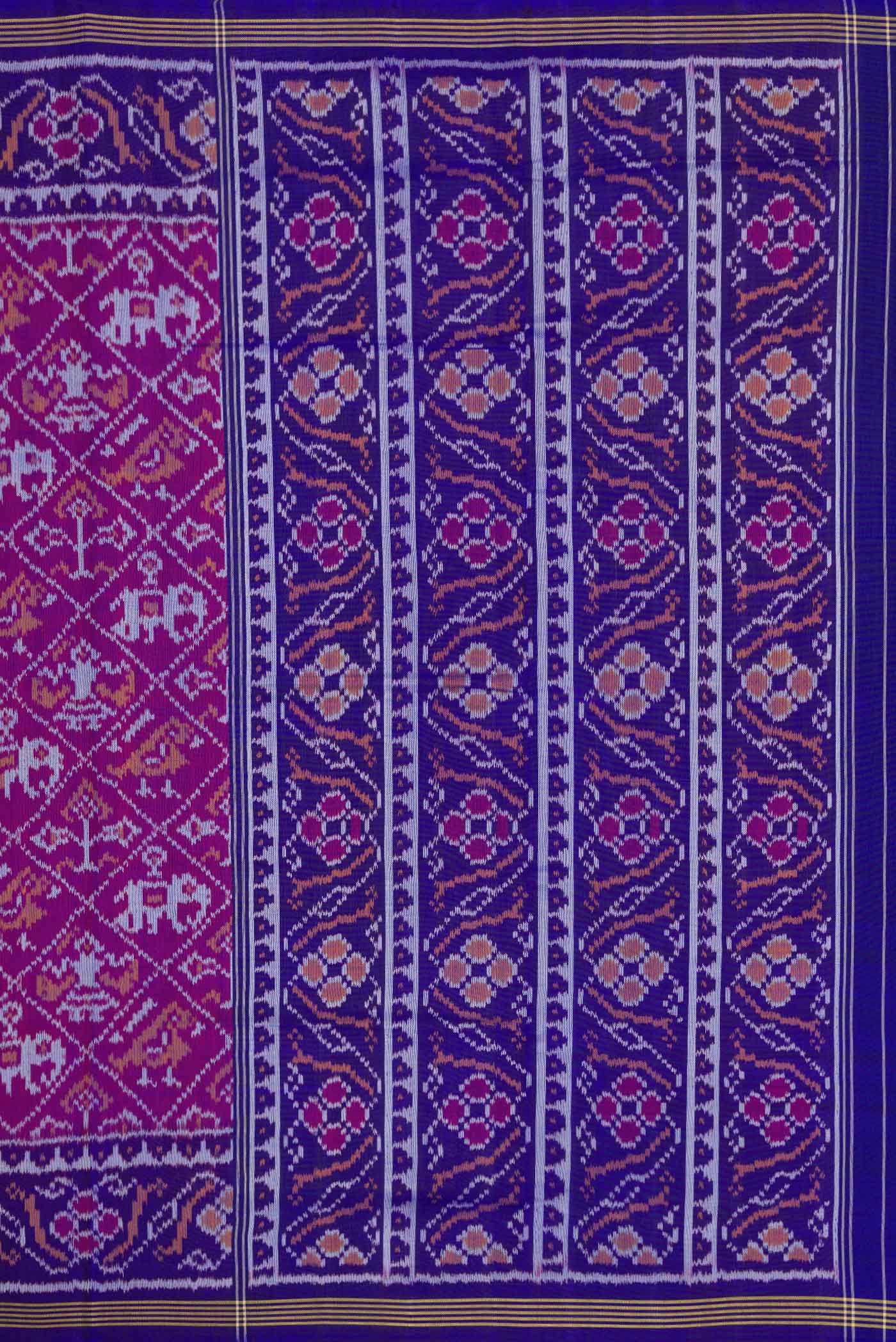 Close up image of the pallu of Purple Dual Tone Rajkot Patola Silk Saree with Ikat Print on the body and Ikat Border
