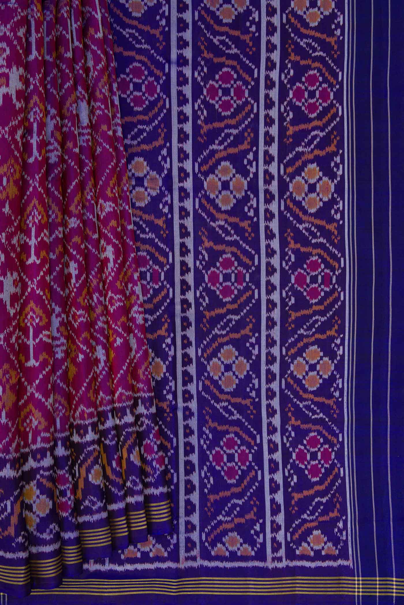Pleats and pallu of Purple Dual Tone Rajkot Patola Silk Saree with Ikat Print on the body and Ikat Border