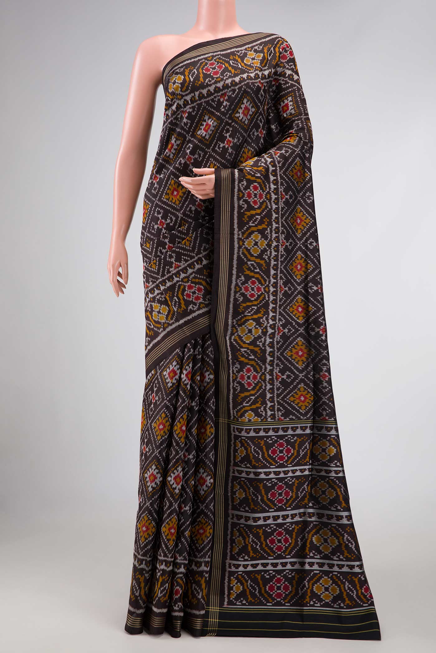 Black Pochampally Silk Saree with Pure Ikat on the body and Plain Border displayed on a mannequin