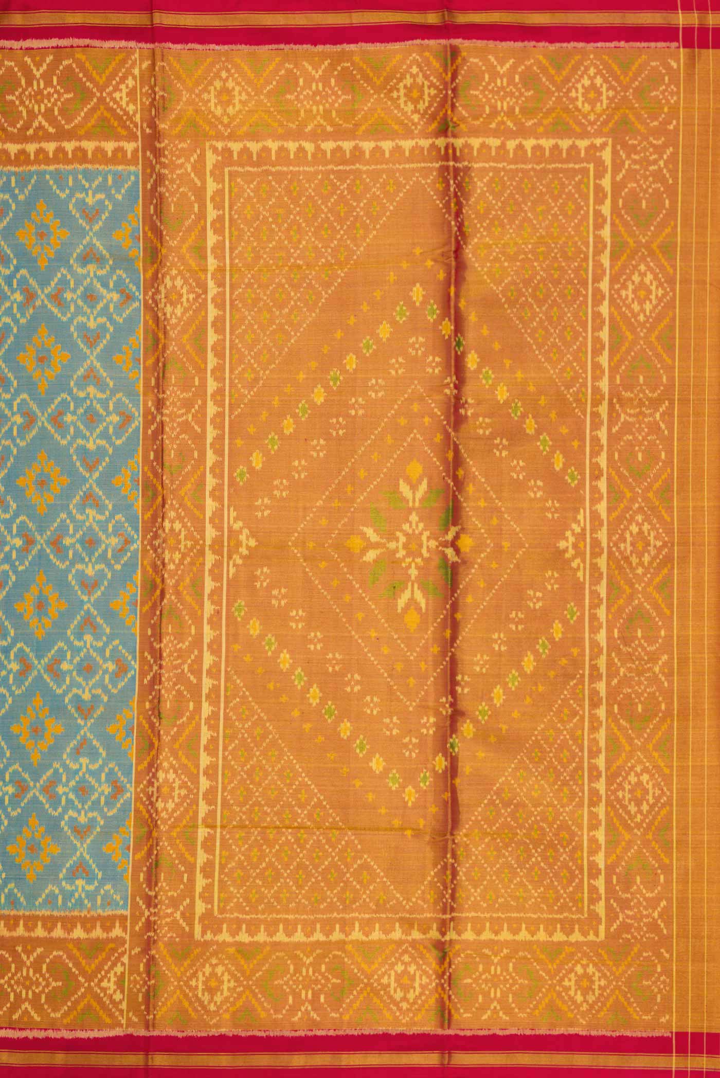 Close up image of the pallu of Light Blue Dual Tone Rajkot Patola Silk Saree with Ikat Print on the body and Zari Border