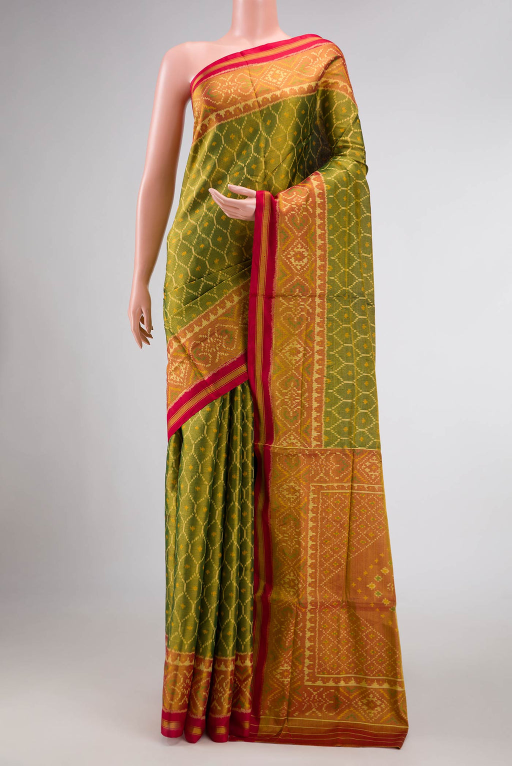 Mehandi Green Dual Tone Rajkot Patola Silk Saree with Ikat Print on the body and Ikat Border displayed on a mannequin