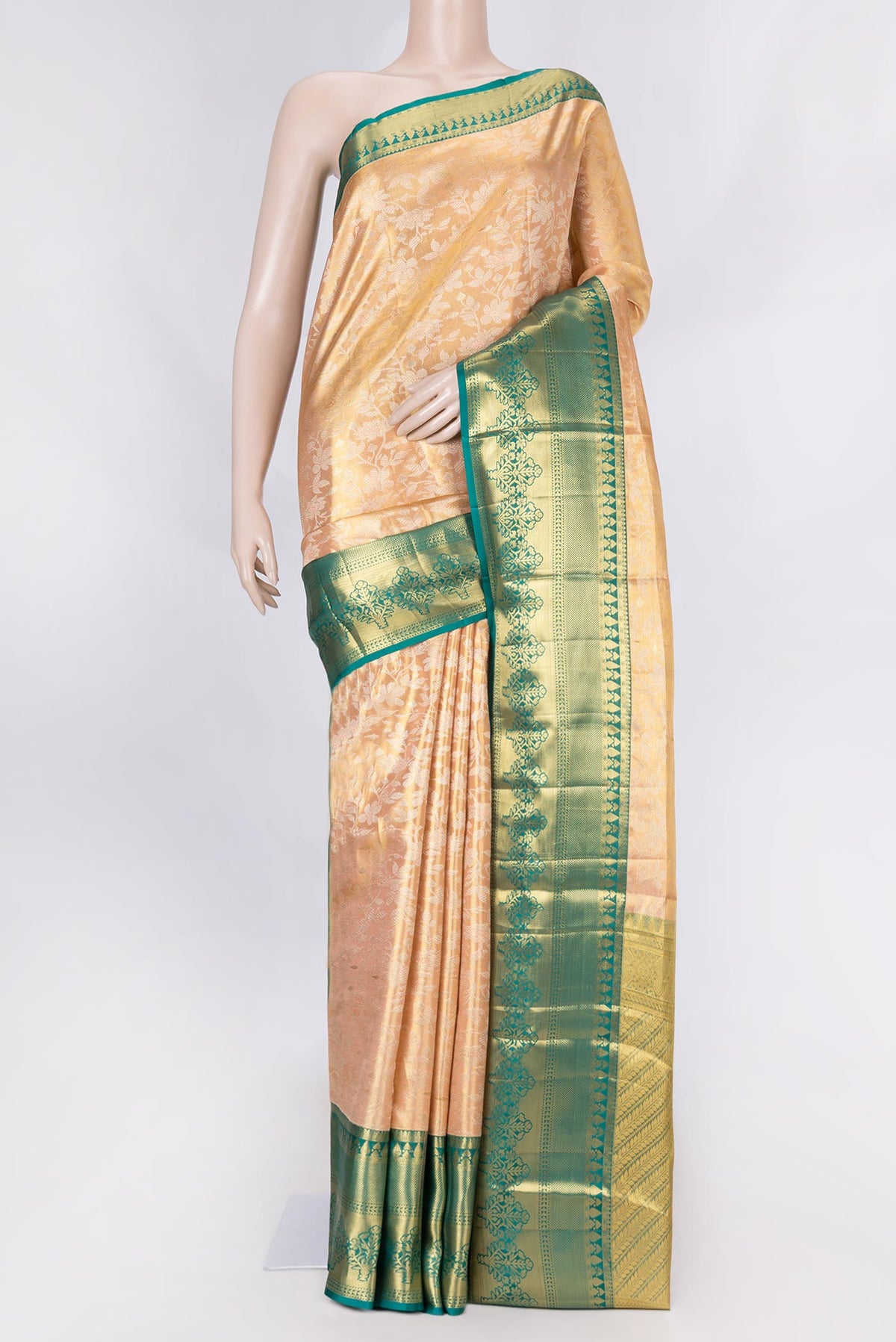Golden Peach Dual Tone Kanchipuram Saree with Zari Brocade on the body and Zari Border displayed on a mannequin