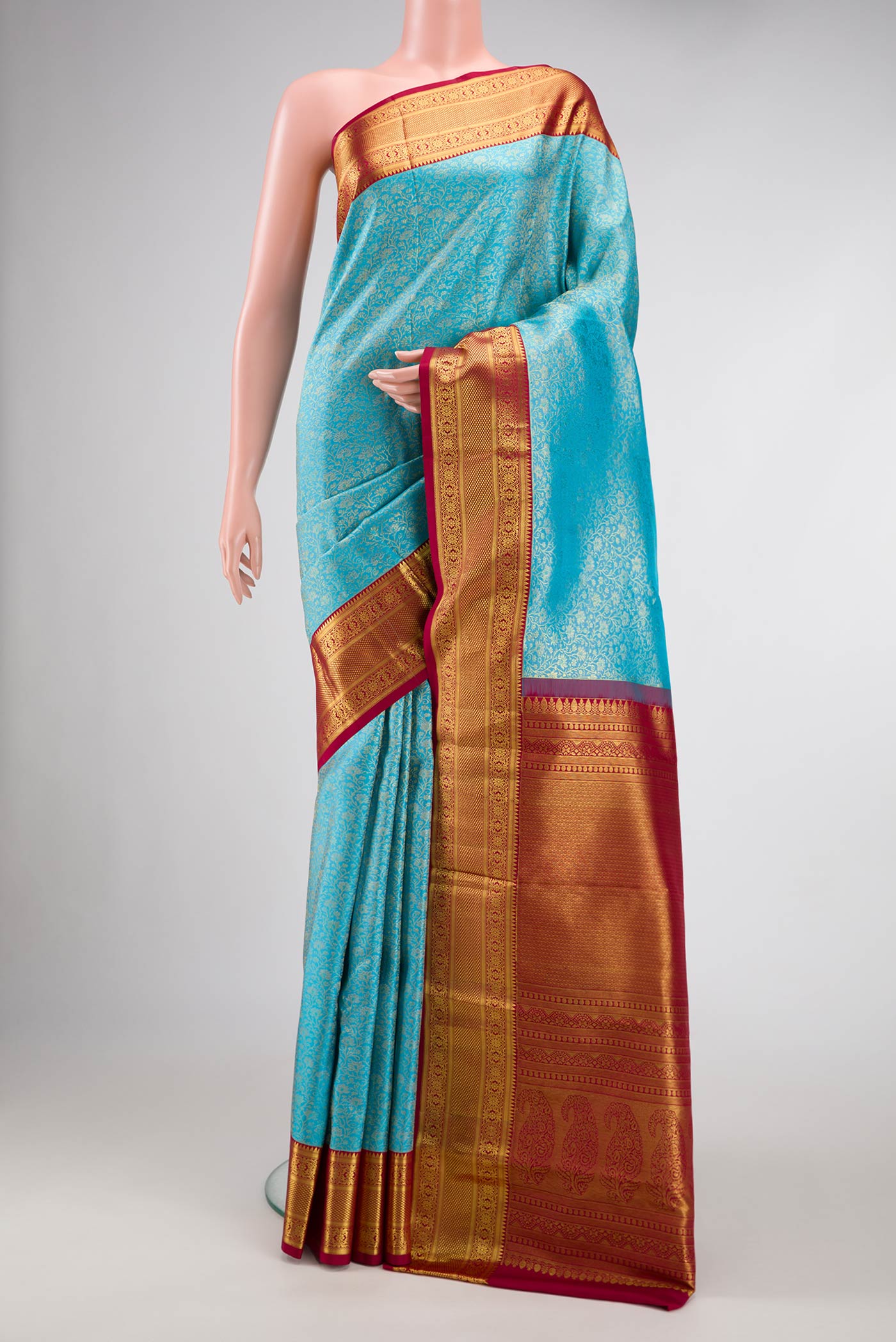 Sky Blue Dual Tone Kanchipuram Silk Saree with Zari Brocade on the body and Zari Border.  displayed on a mannequin