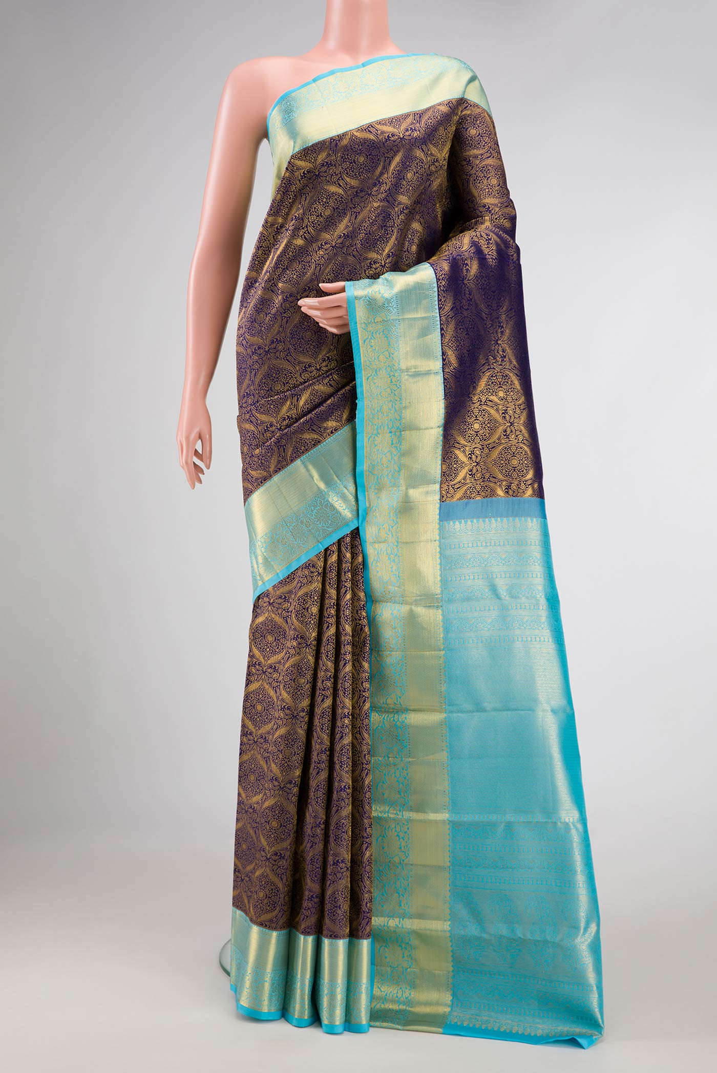 Navy Blue Dual Tone Kanchipuram Silk Saree with Zari Brocade on the body and Zari Border.  displayed on a mannequin