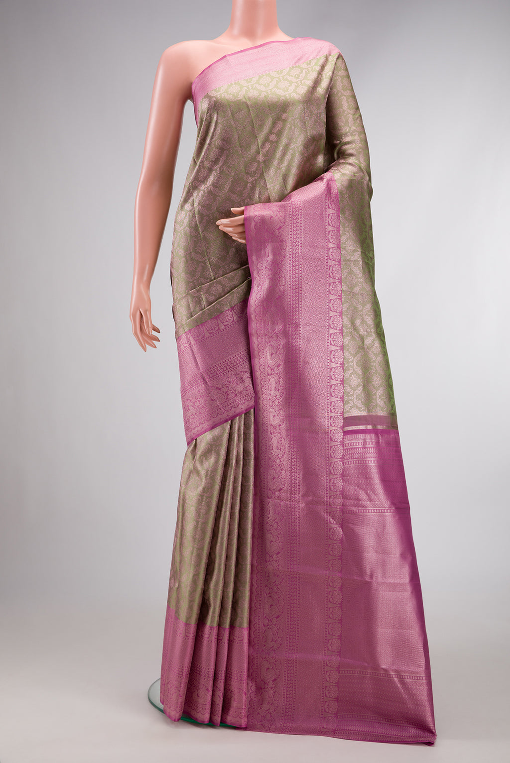 Pista Green Dual Tone Kanjivaram Silk Saree with Zari Brocade on the body and Zari Border.  displayed on a mannequin