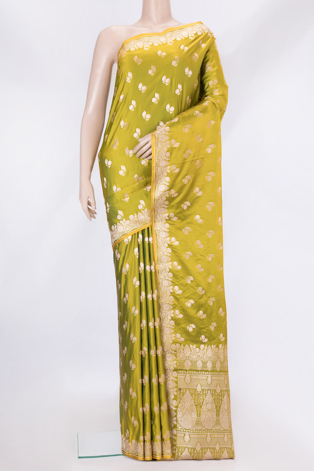 Mehandi Green Dual Tone Banarasi Silk Saree with Zari Butta on the body and Fancy Border.  displayed on a mannequin