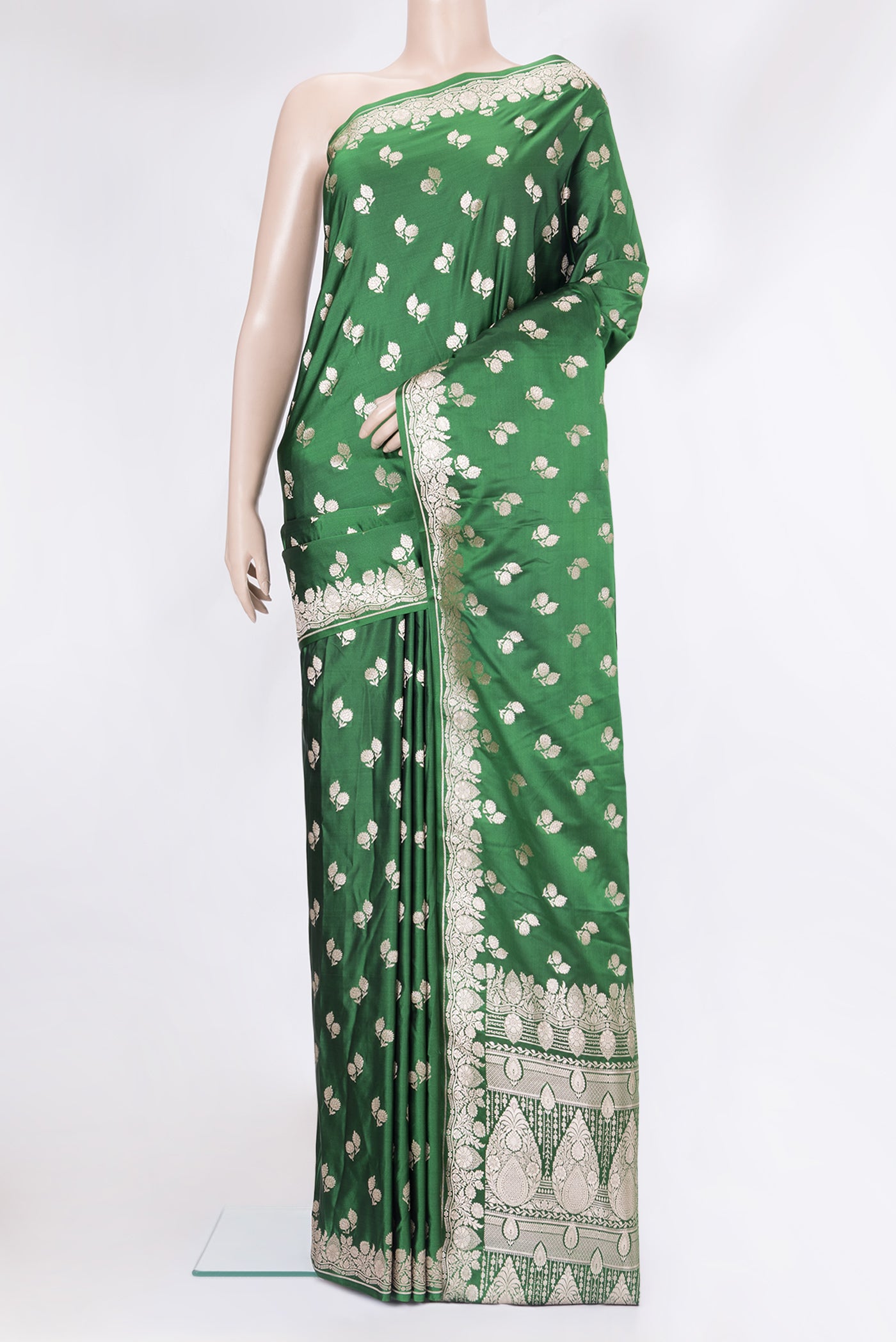 Green Blended Banarasi Silk Saree with Zari Butta on the body and Zari Border.  displayed on a mannequin