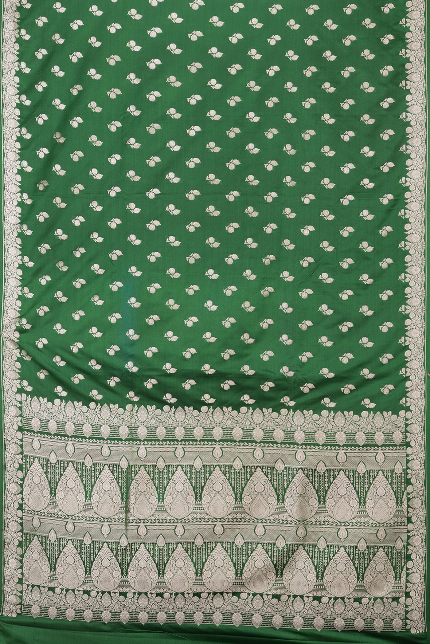 Flat view of Green Blended Banarasi Silk Saree with Zari Butta on the body and Zari Border. 