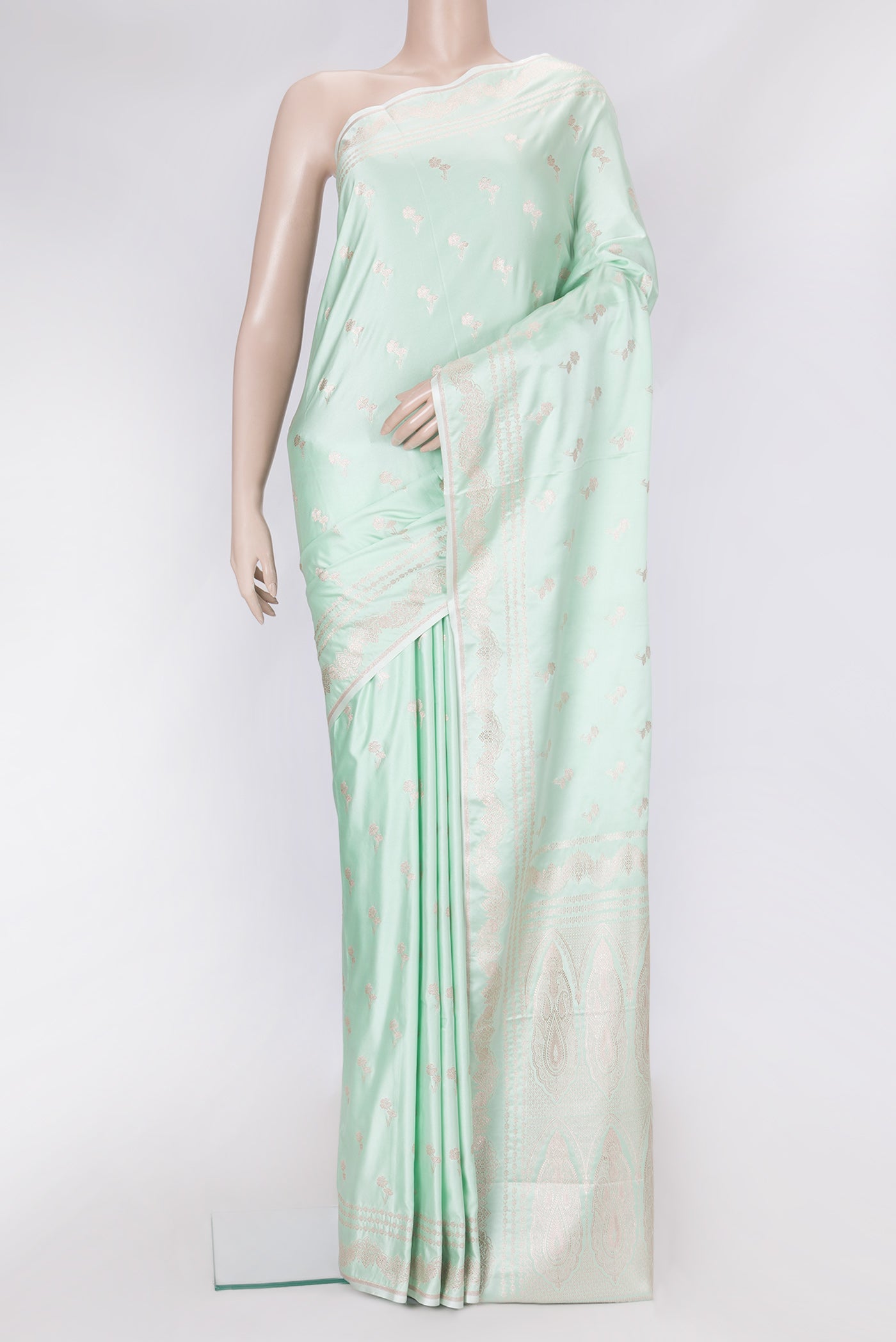 Sea Green Dual Tone Banarasi Silk Saree with Zari Butta on the body and Fancy Border.  displayed on a mannequin