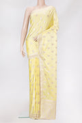 Lemon Yellow Blended Banarasi Silk Saree with Zari Butta on the body and Zari Border.  displayed on a mannequin