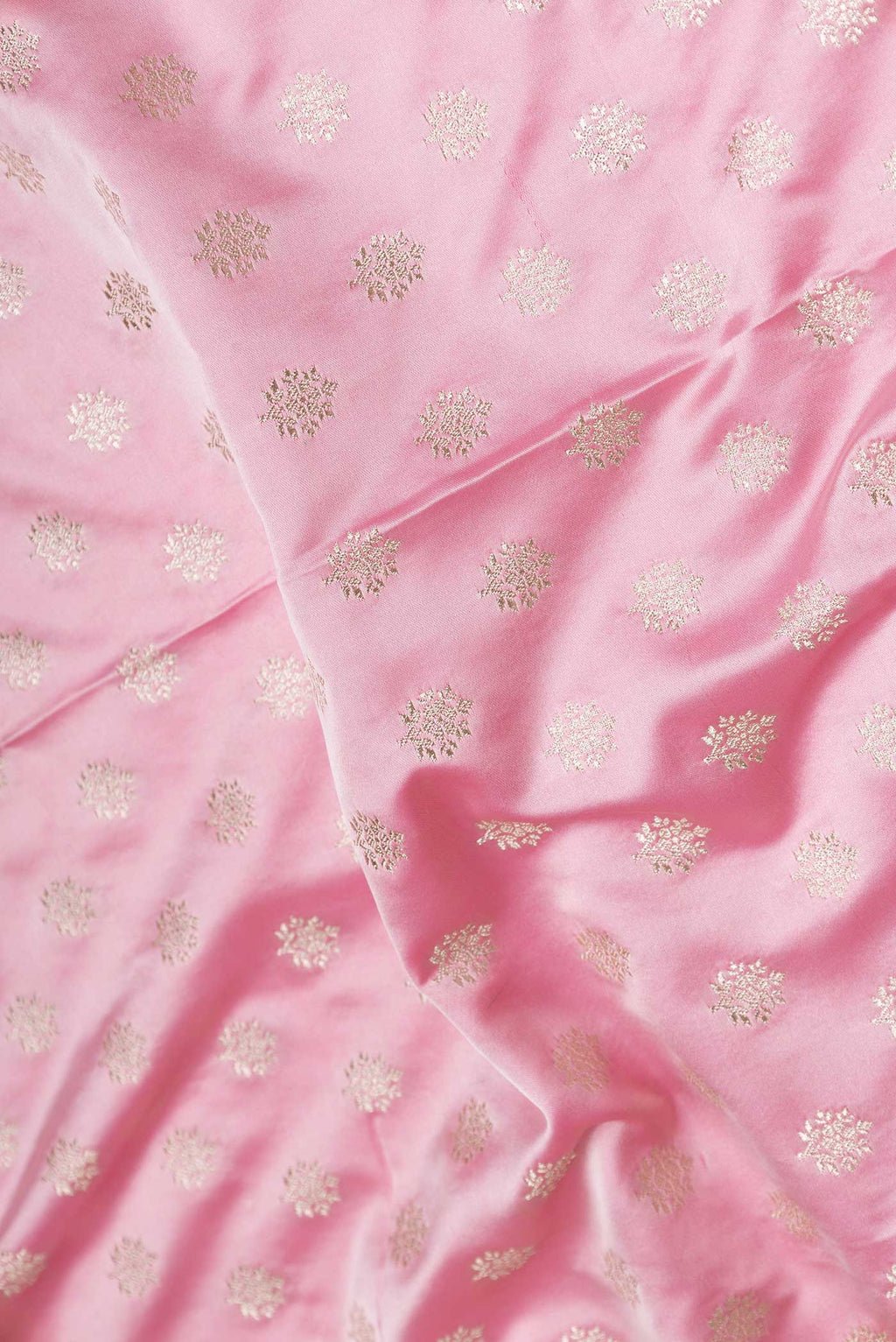 Close up of Pink Dual Tone Blended Banarasi Silk Saree with Zari Butta on the body and Zari Border displaying folds