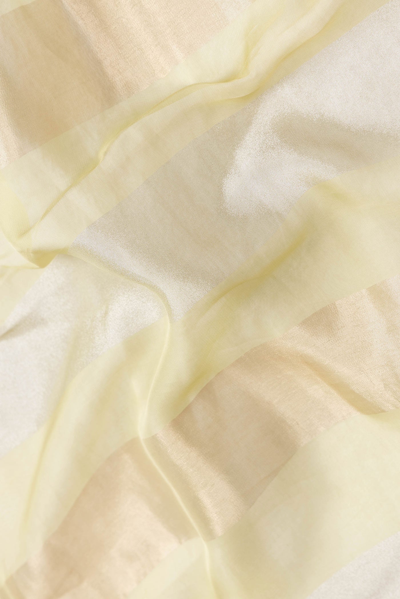 Close up of Pista Green Dual Tone Mysore Georgette Saree with Stripes on the body and Sequin Border.  displaying folds