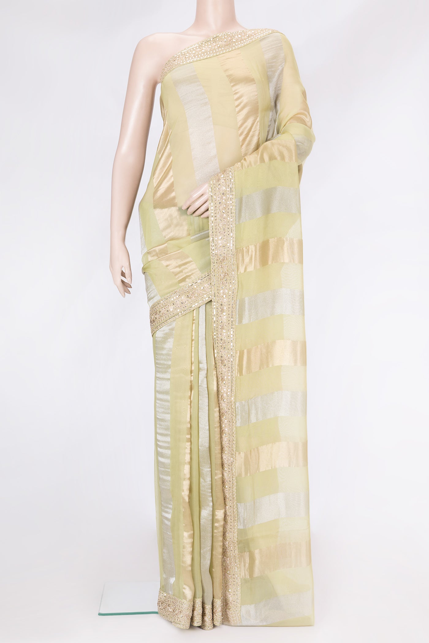 Pista Green Dual Tone Mysore Georgette Saree with Stripes on the body and Sequin Border.  displayed on a mannequin