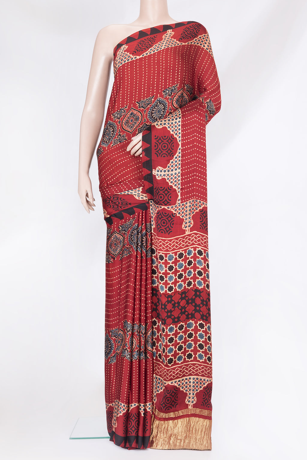 Maroon Satin Crepe Saree with Printed design on the body and Printed Border.  displayed on a mannequin