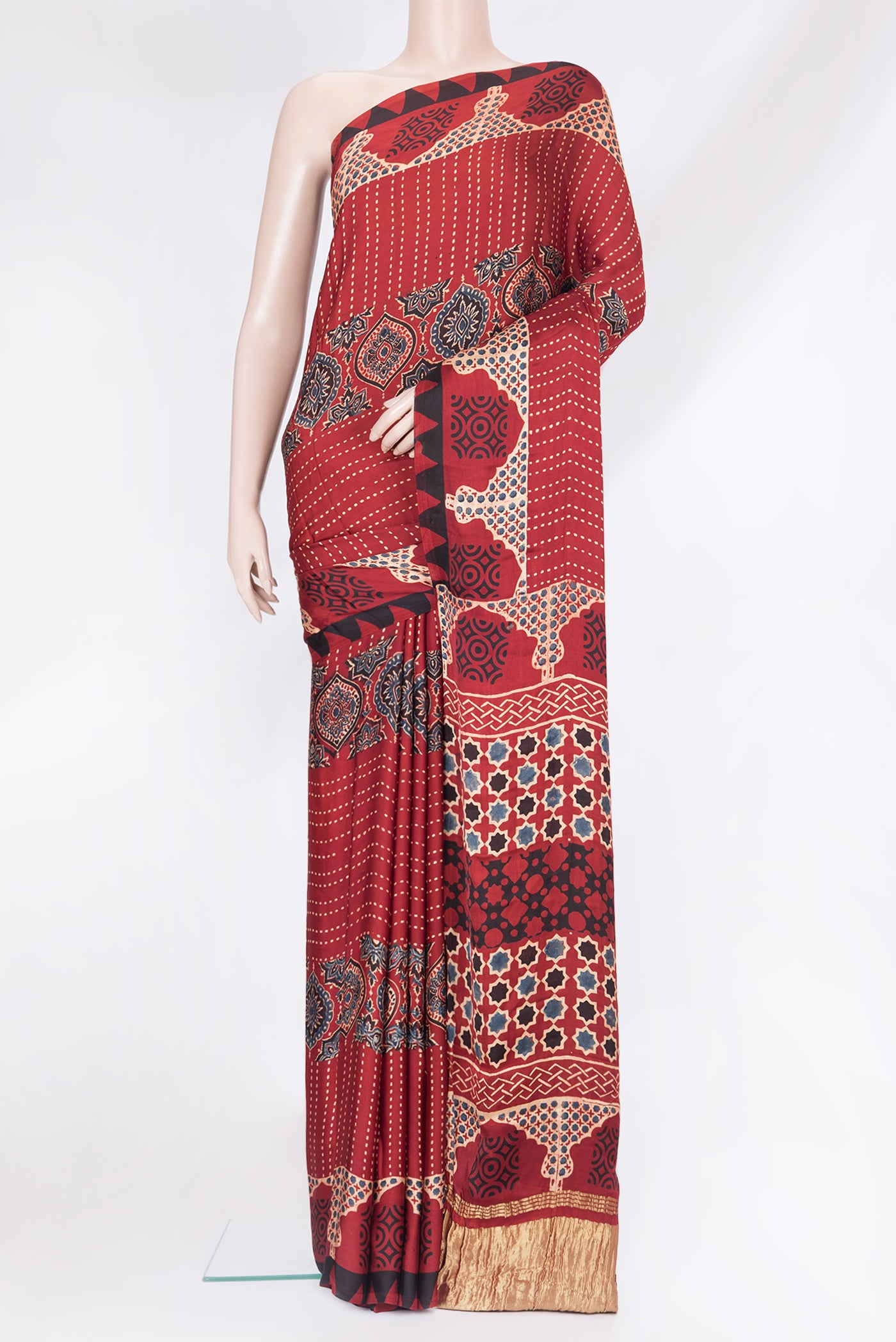 Maroon Satin Crepe Saree with Printed design on the body and Printed Border.  displayed on a mannequin