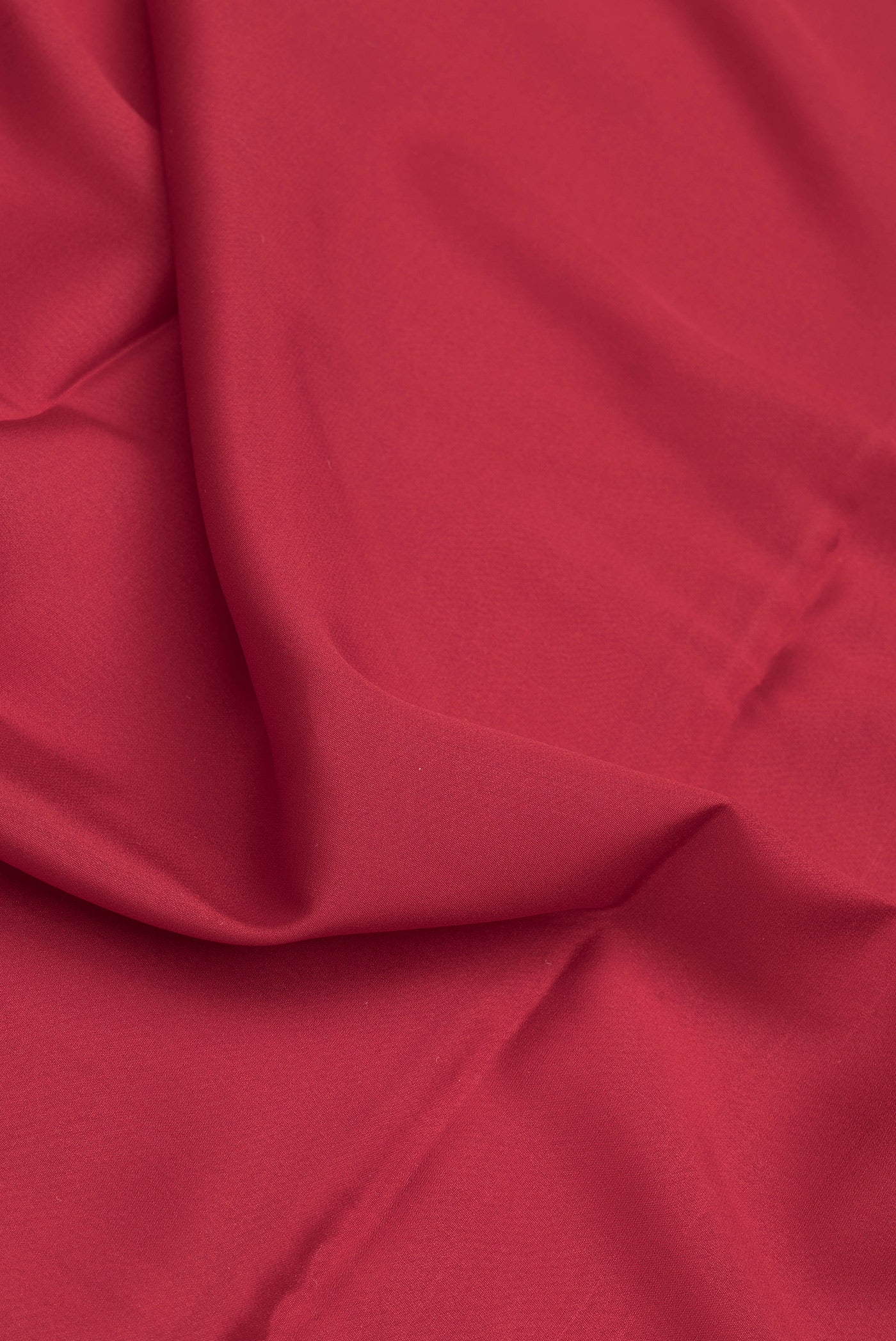 Close up of Maroon Dual Tone Mysore Silk Saree with Plain Body and Zari Border.  displaying folds