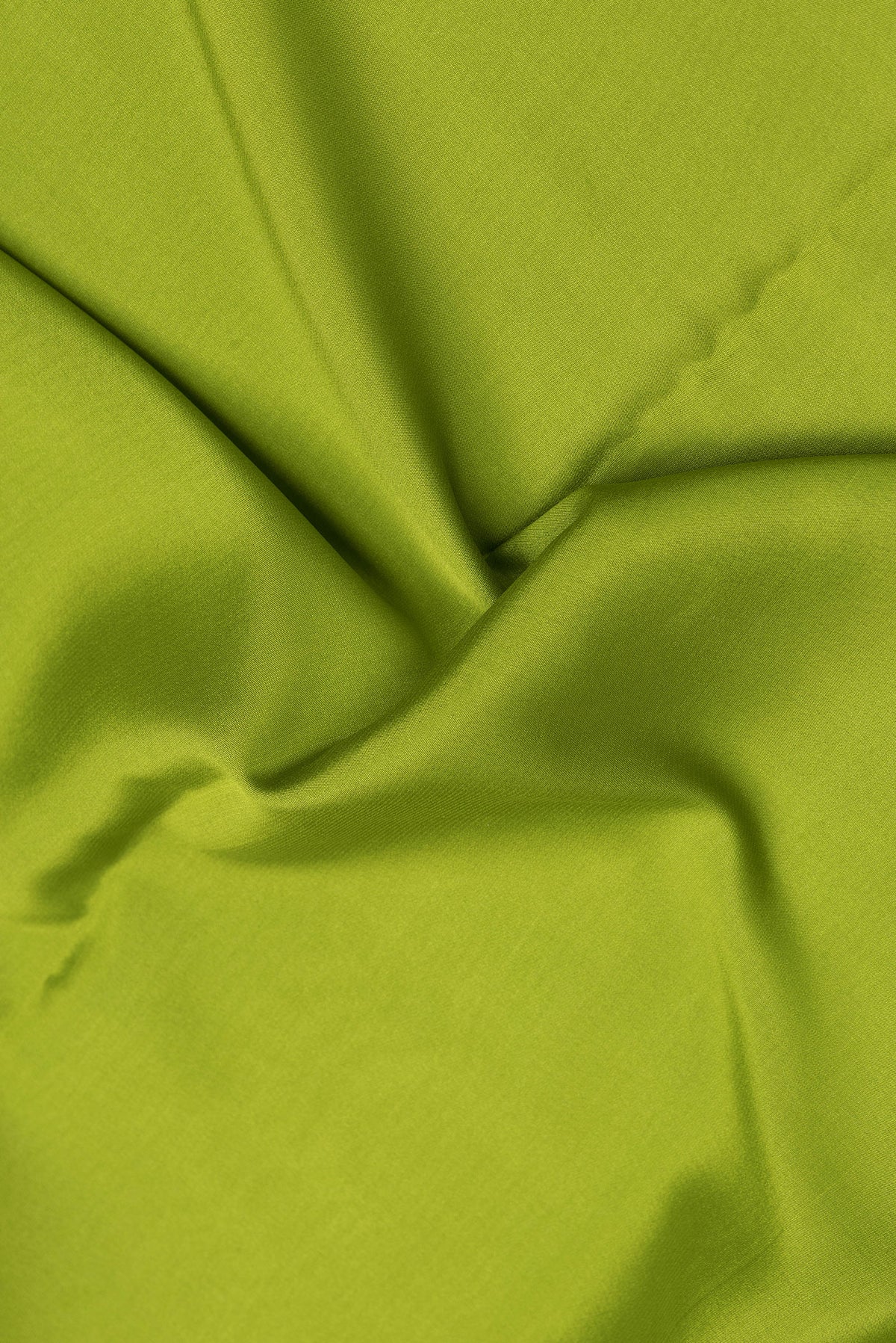 Close up of Parrot Green Dual Tone Mysore Silk Saree with Plain Body and Zari Border.  displaying folds