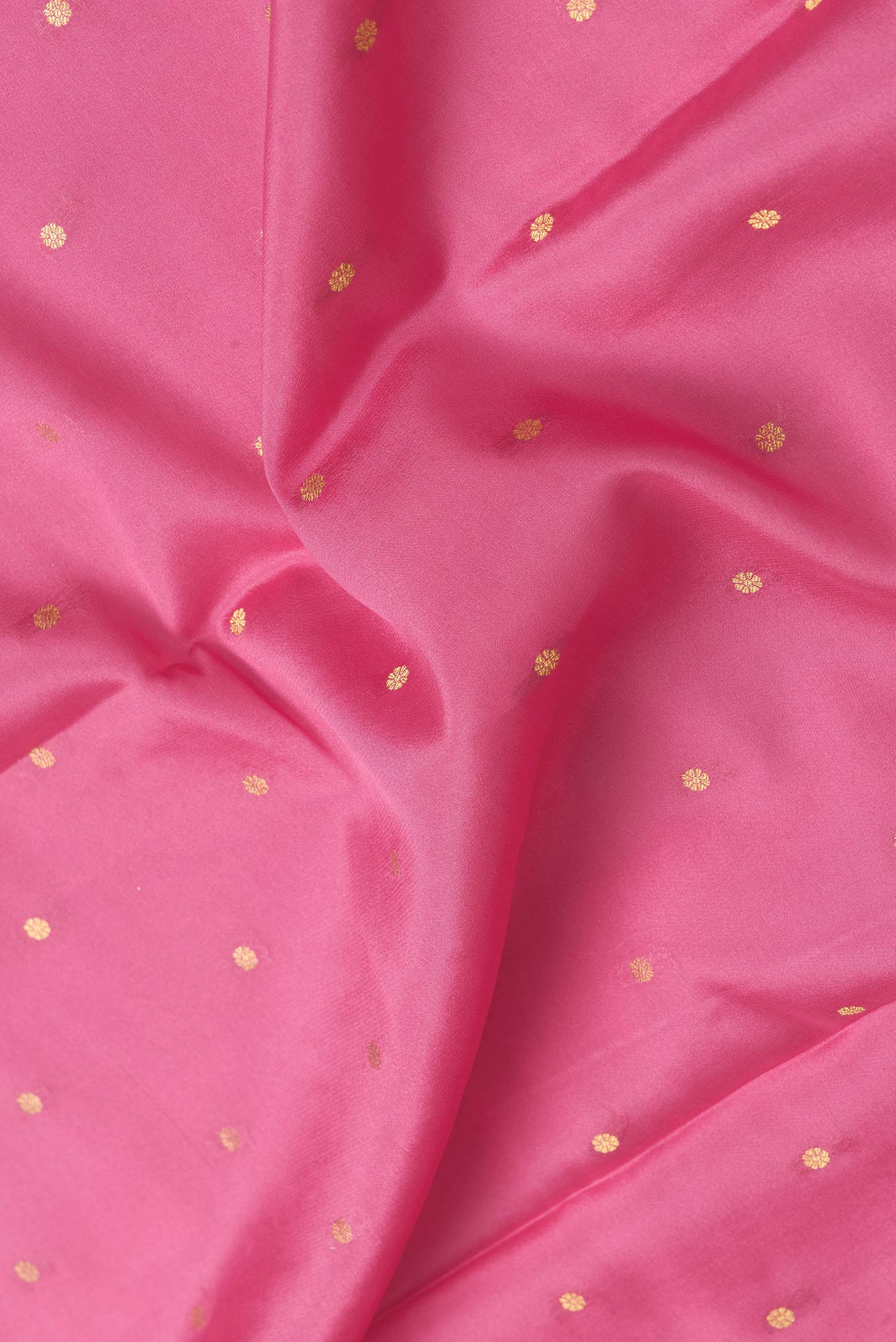 Close up of Pink Dual Tone Mysore Silk Saree with Zari Butta on the body and Zari Border.  displaying folds