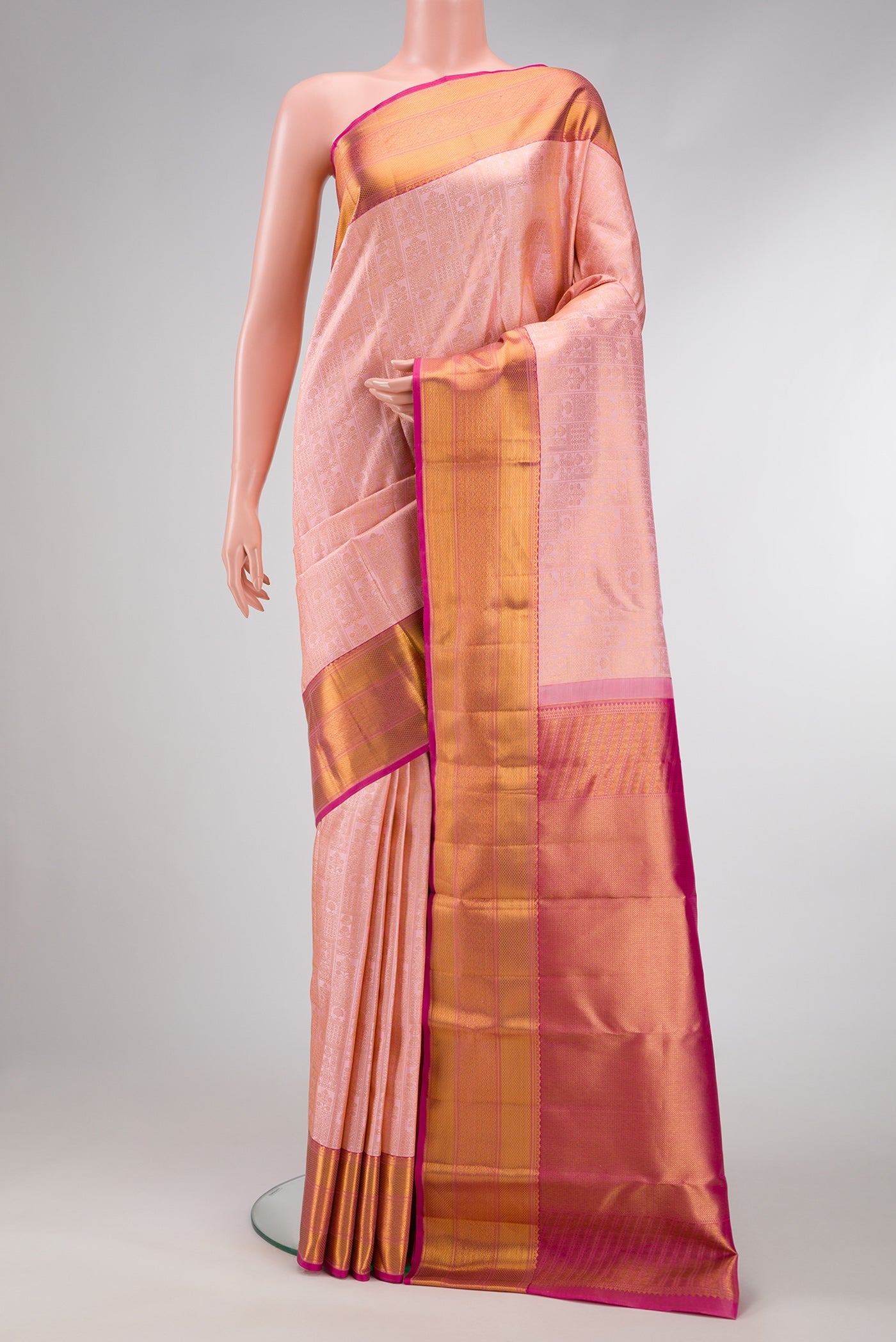 Rose Gold Dual Tone Kanchipuram Silk Saree with Zari Brocade on the body and Zari Border.  displayed on a mannequin