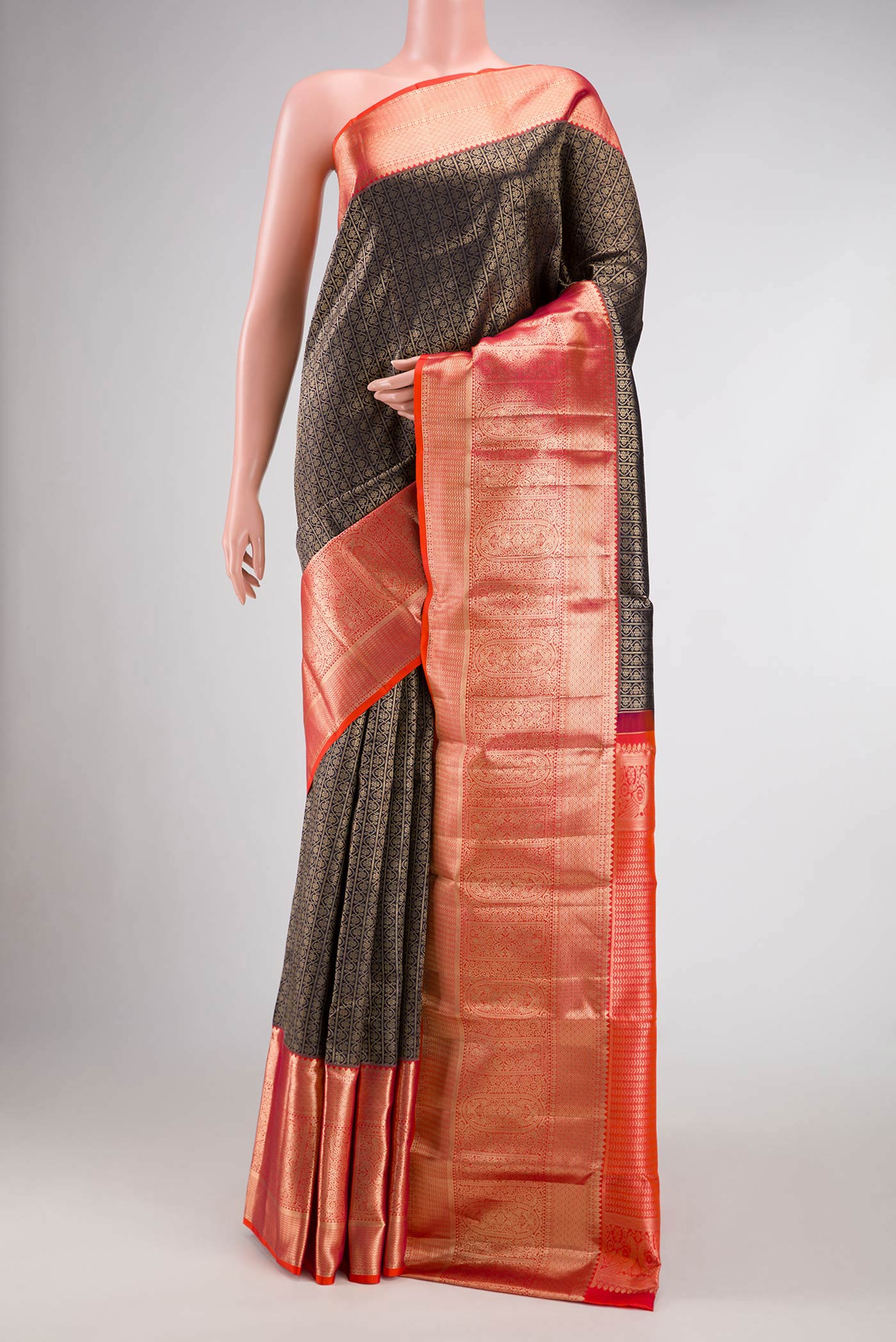 Black Dual Tone Kanchipuram Silk Saree with Zari Brocade on the body and Zari Border.  displayed on a mannequin