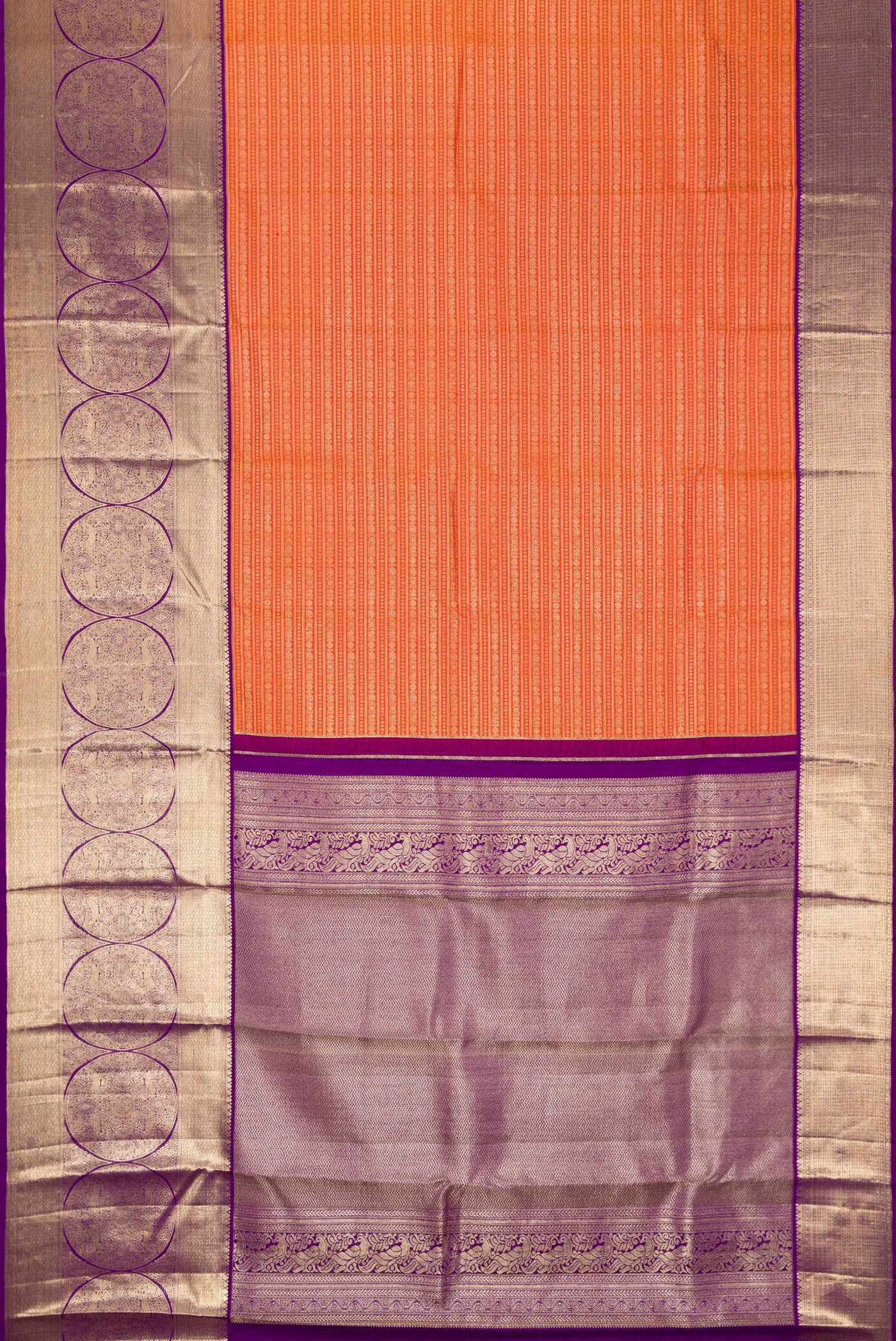 Flat view of Orange Kanjivaram Silk Saree with Zari Brocade on the body and Zari Border. 