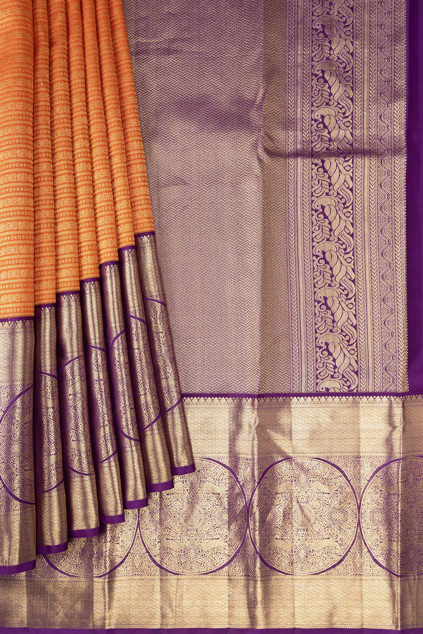 Pleats and pallu of Orange Kanjivaram Silk Saree with Zari Brocade on the body and Zari Border. 