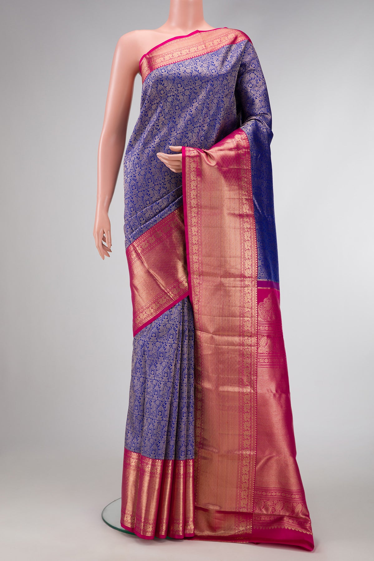 Royal Blue Dual Tone Kanjivaram Silk Saree with Zari Brocade on the body and Zari Border.  displayed on a mannequin