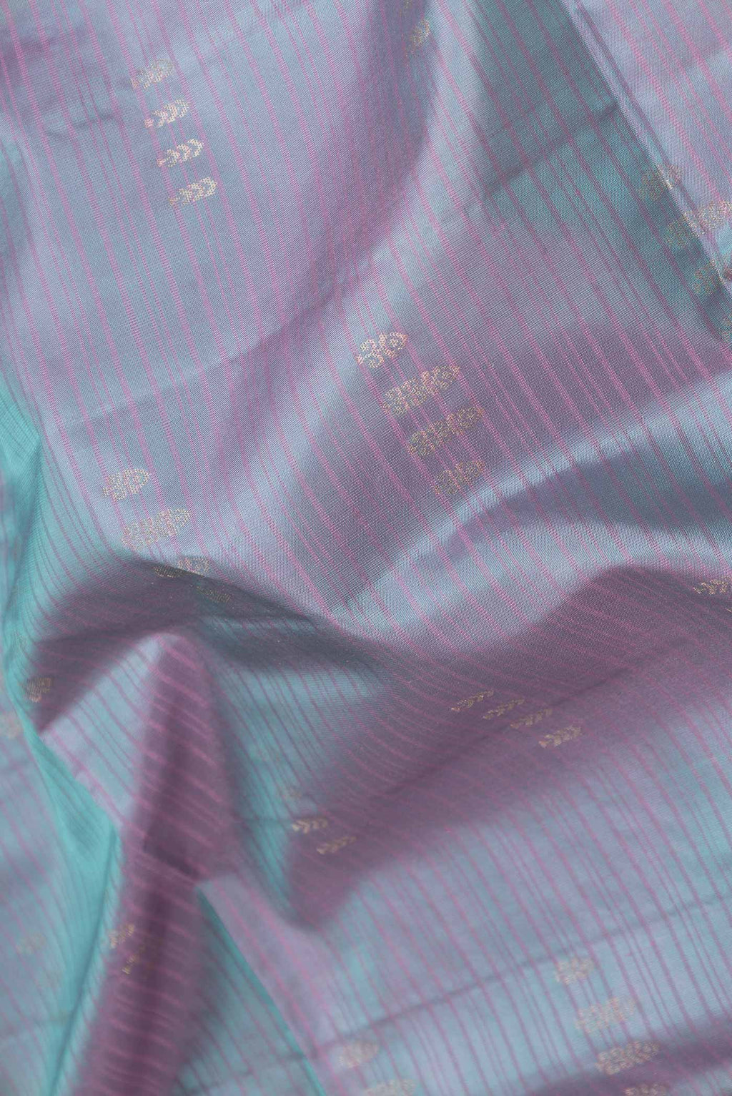 Close up of Lavender Dual Tone Soft Silk Saree with Stripes on the body and Zari Border displaying folds