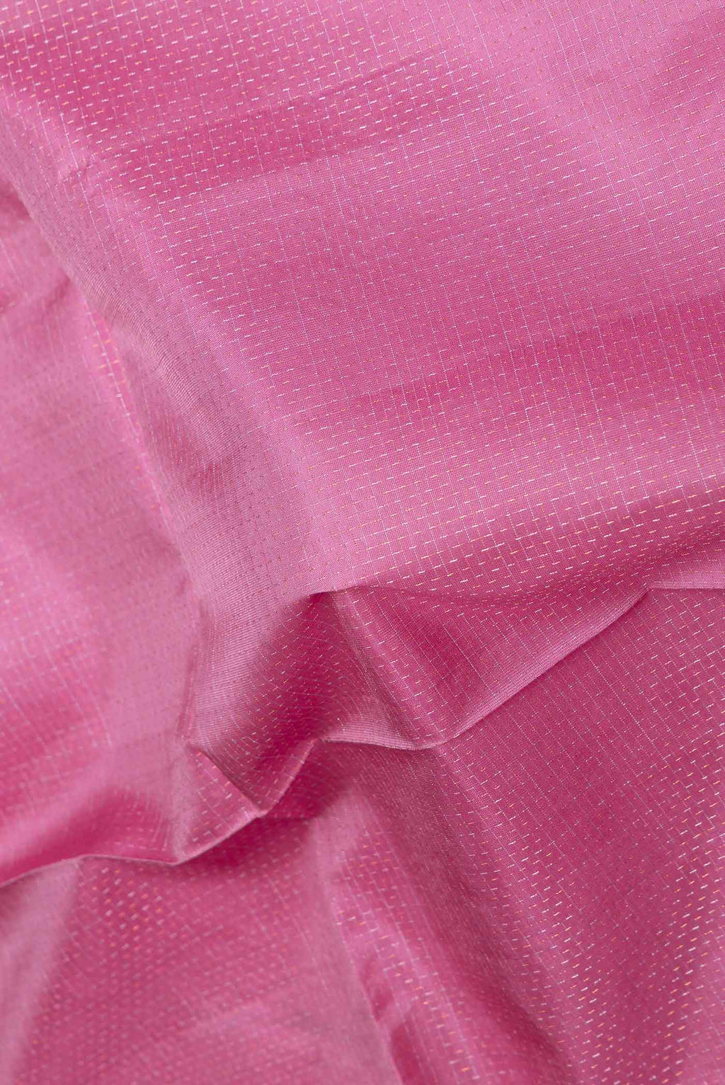 Close up of Pink Dual Tone Soft Silk Saree with Checked design on the body and Zari Border displaying folds