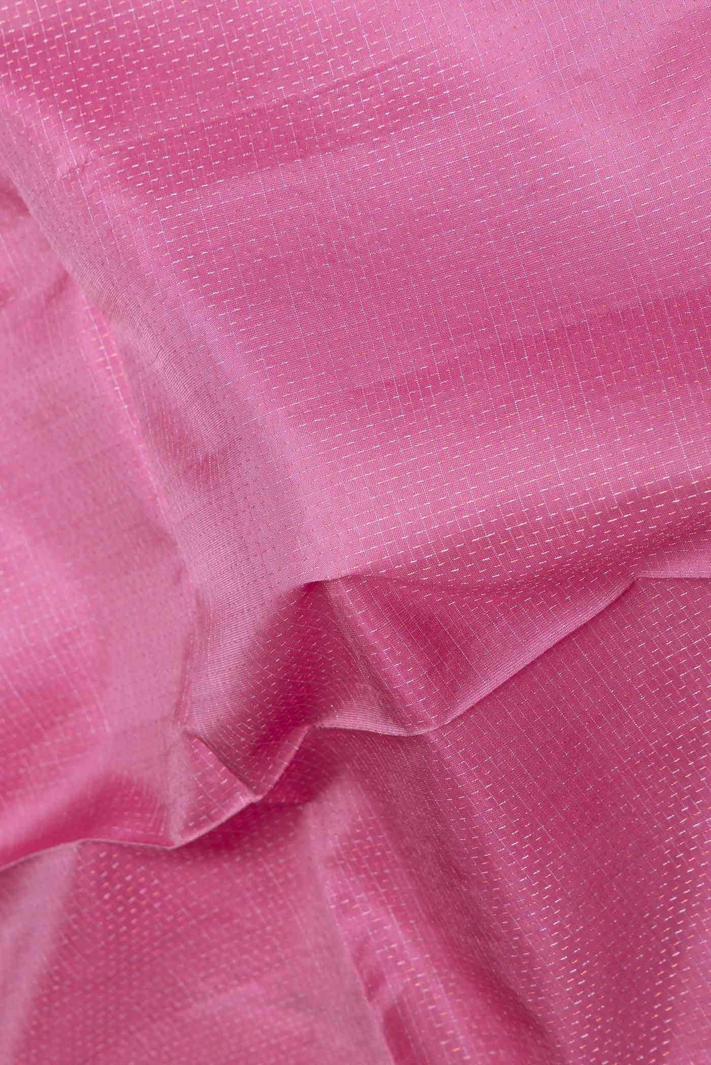 Close up of Pink Dual Tone Soft Silk Saree with Checked design on the body and Zari Border displaying folds