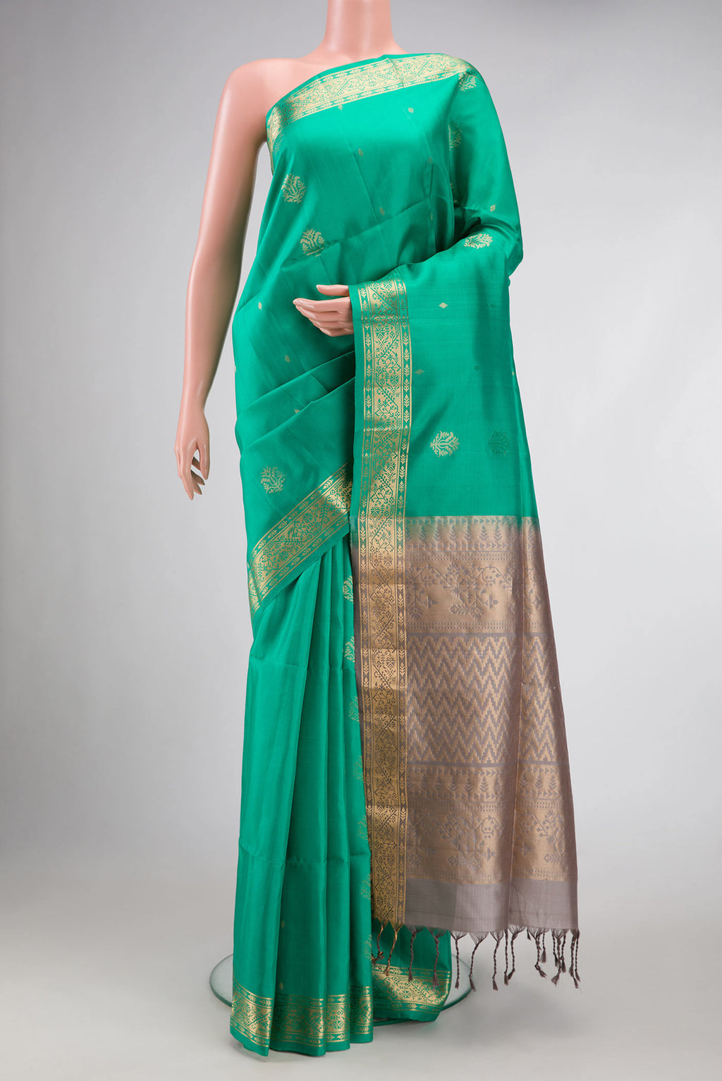 Sea Green Dual Tone Soft Silk Saree with Zari Butta on the body and Zari Border.  displayed on a mannequin