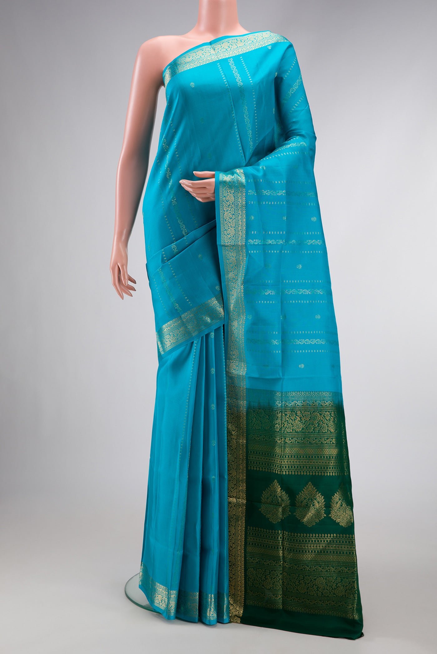 Sky Blue Dual Tone Soft Silk Saree with Zari Butta on the body and Zari Border.  displayed on a mannequin