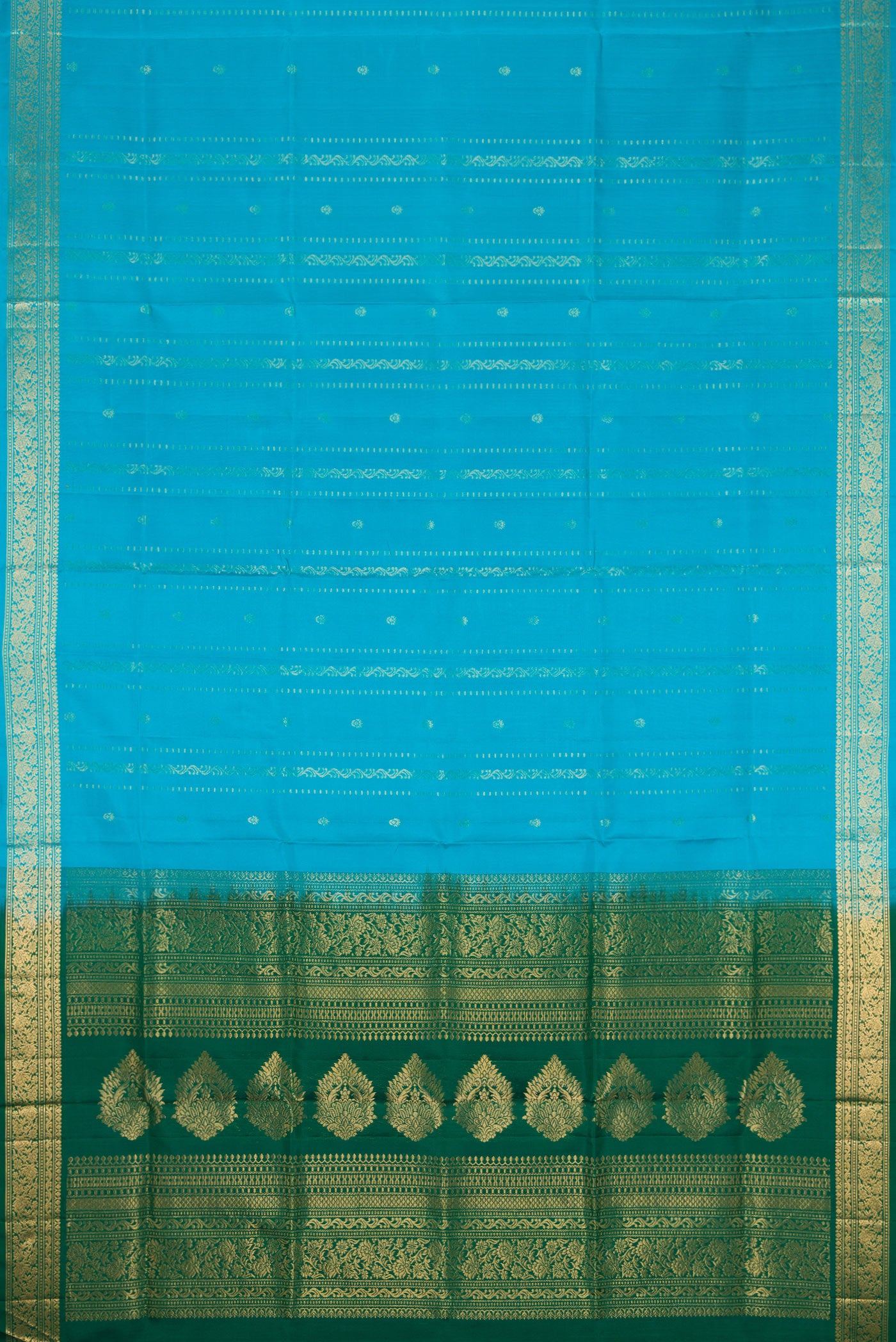 Flat view of Sky Blue Dual Tone Soft Silk Saree with Zari Butta on the body and Zari Border. 