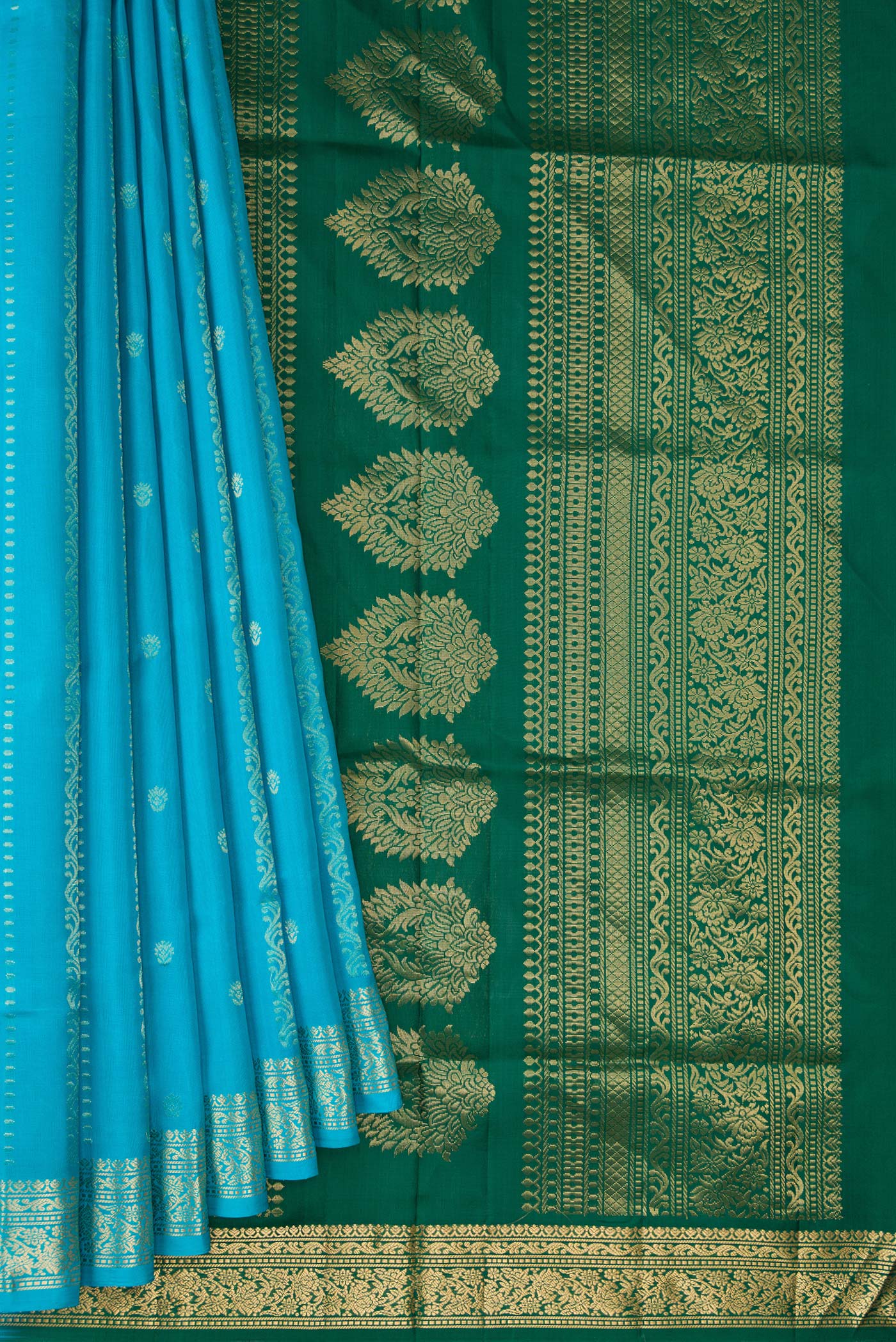 Pleats and pallu of Sky Blue Dual Tone Soft Silk Saree with Zari Butta on the body and Zari Border. 
