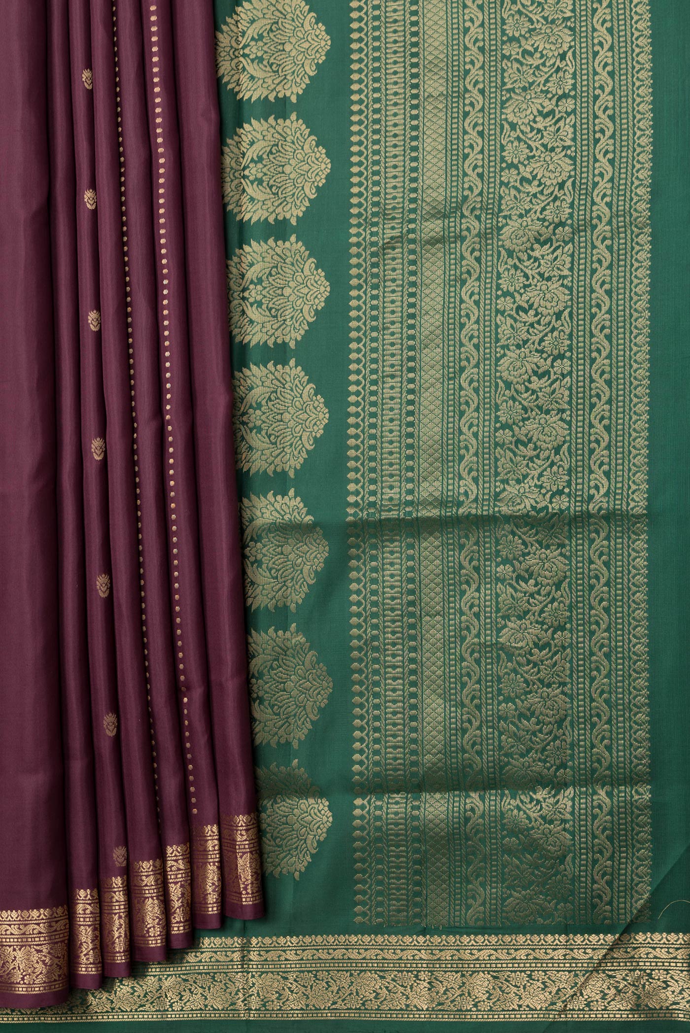 Pleats and pallu of Maroon Dual Tone Soft Silk Saree with Zari Butta on the body and Zari Border. 