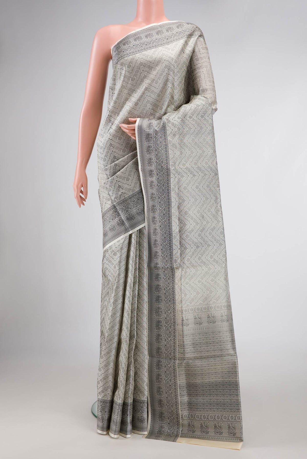 Off White Dual Tone Soft Silk Saree with Jacquard design on the body and Thread Border.  displayed on a mannequin