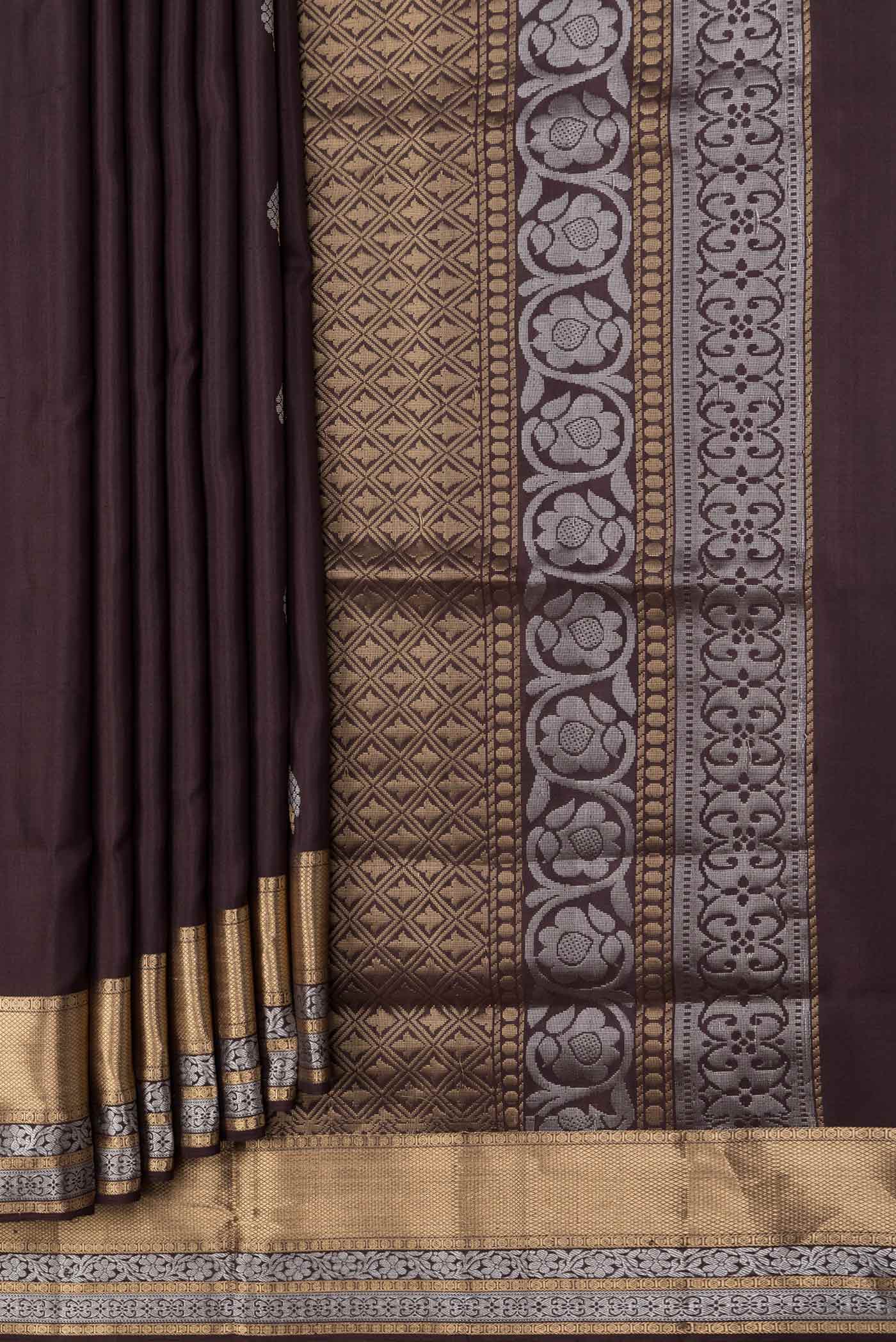 Pleats and pallu of Coffee Brown Dual Tone Soft Silk Saree with Zari Butta on the body and Zari Border. 