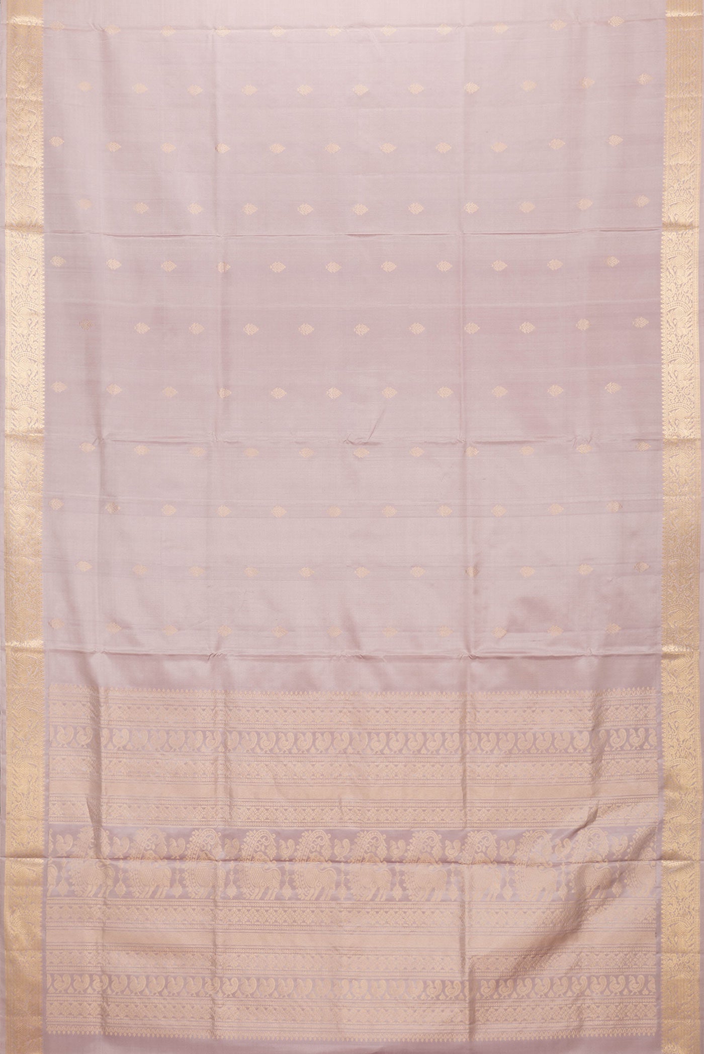 Flat view of Rose Gold Dual Tone Soft Silk Saree with Zari Butta on the body and Zari Border. 