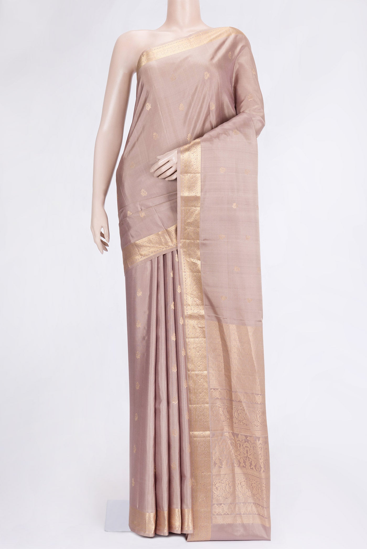 Beige Dual Tone Soft Silk Saree with Zari Butta on the body and Zari Border.  displayed on a mannequin