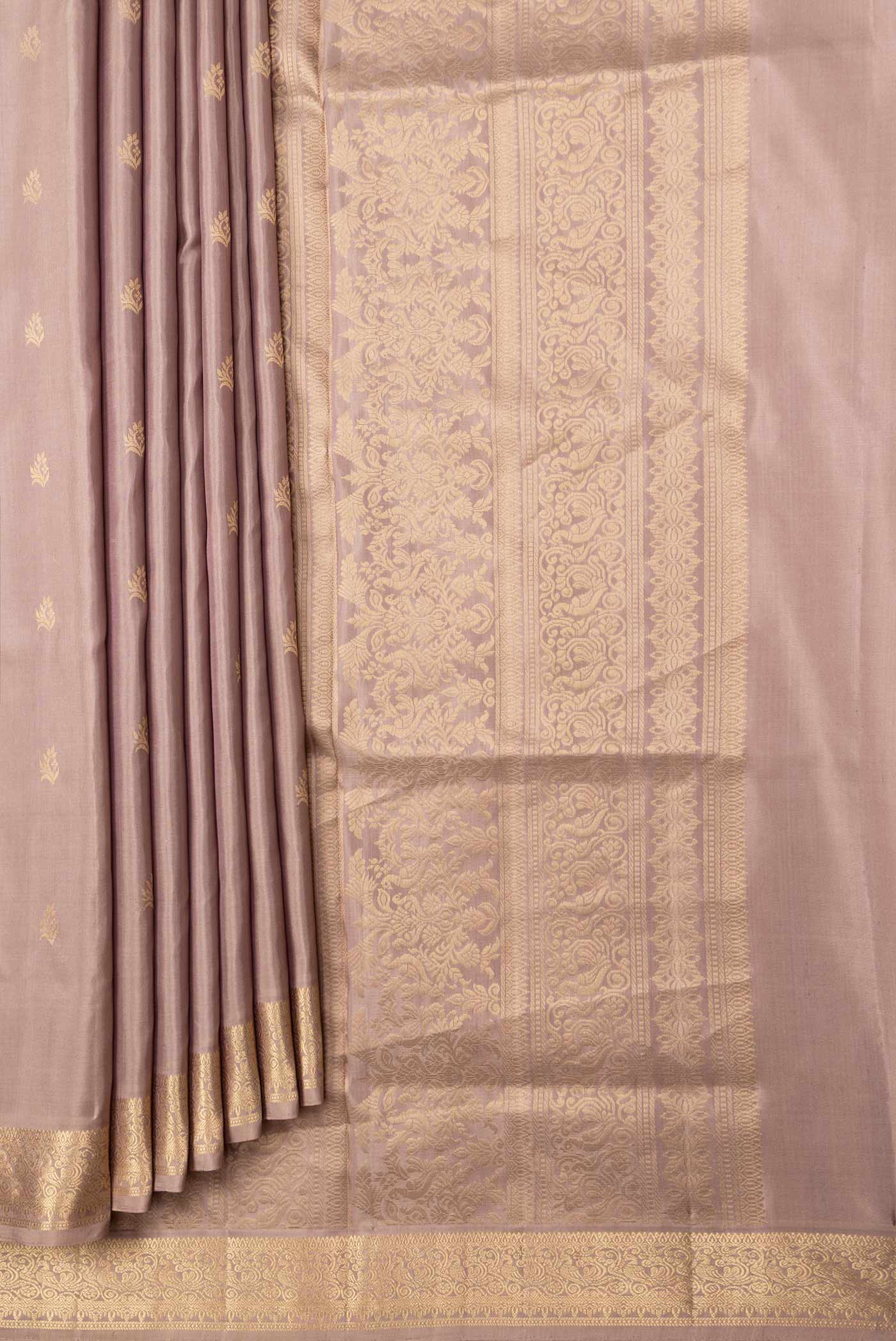 Pleats and pallu of Beige Dual Tone Soft Silk Saree with Zari Butta on the body and Zari Border. 