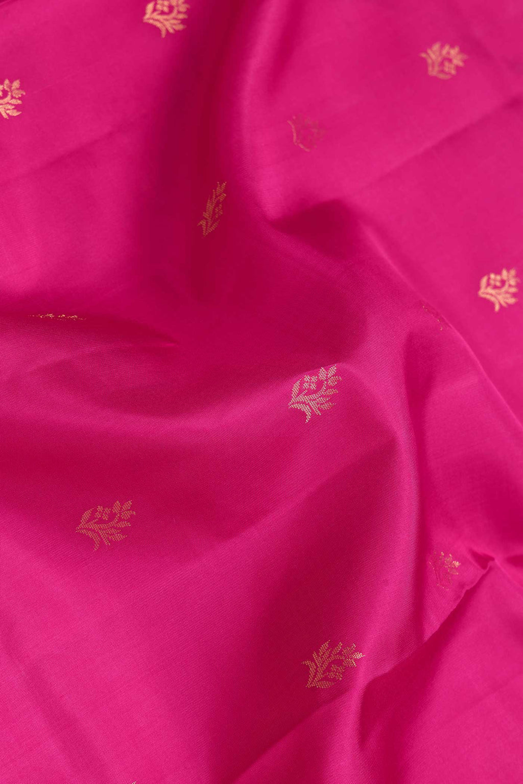 Close up of Dark Pink Dual Tone Soft Silk Saree with Zari Butta on the body and Zari Border.  displaying folds