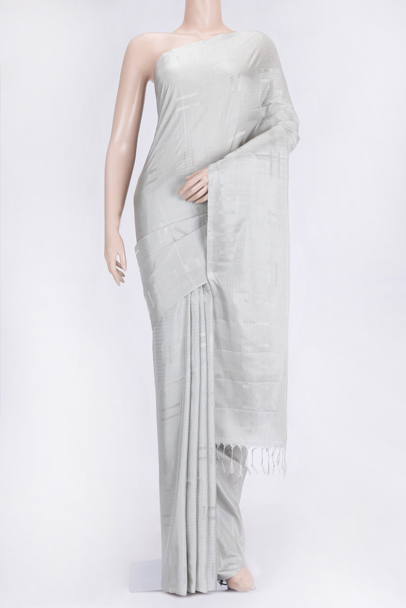 Grey Dual Tone Soft Silk Saree with Zari Butta on the body and Zari Border.  displayed on a mannequin