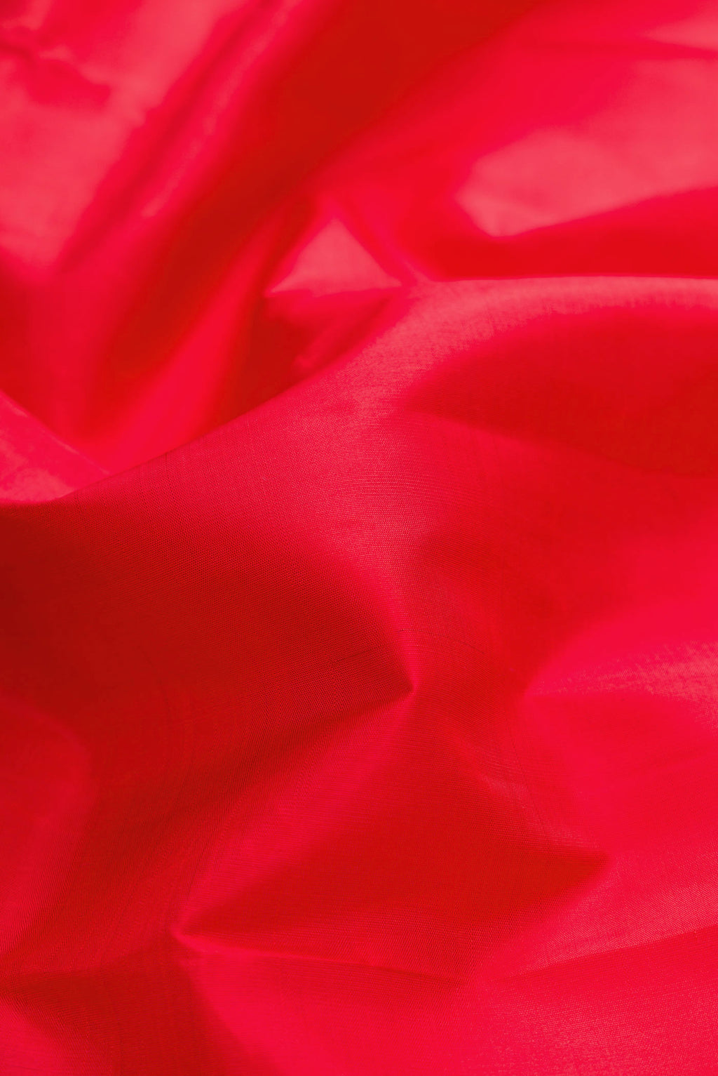Close up of Red Dual Tone Kanchipuram Silk Saree with Plain Body and Temple Border displaying folds