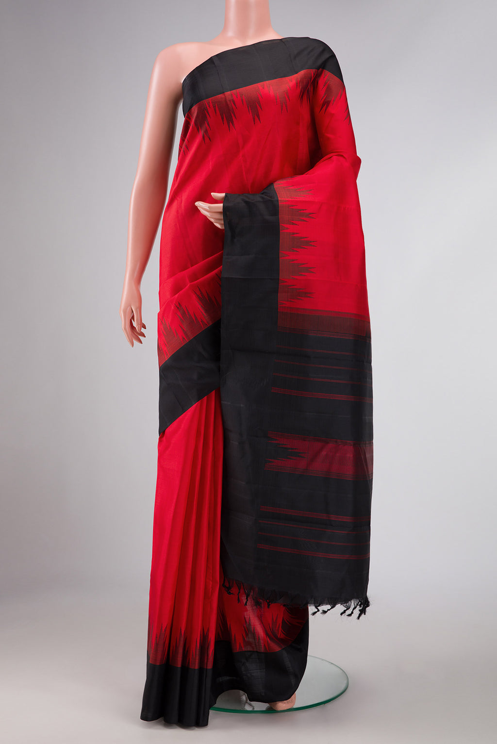 Red Dual Tone Kanchipuram Silk Saree with Plain Body and Temple Border displayed on a mannequin