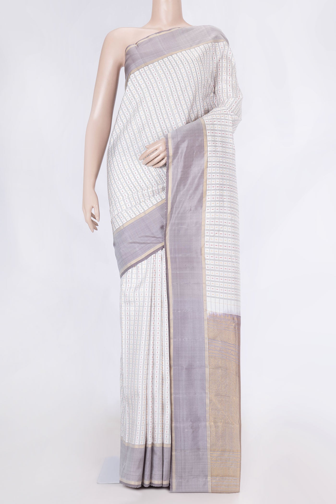 Off White Dual Tone Kanchipuram Saree with Checked design on the body and Zari Border displayed on a mannequin