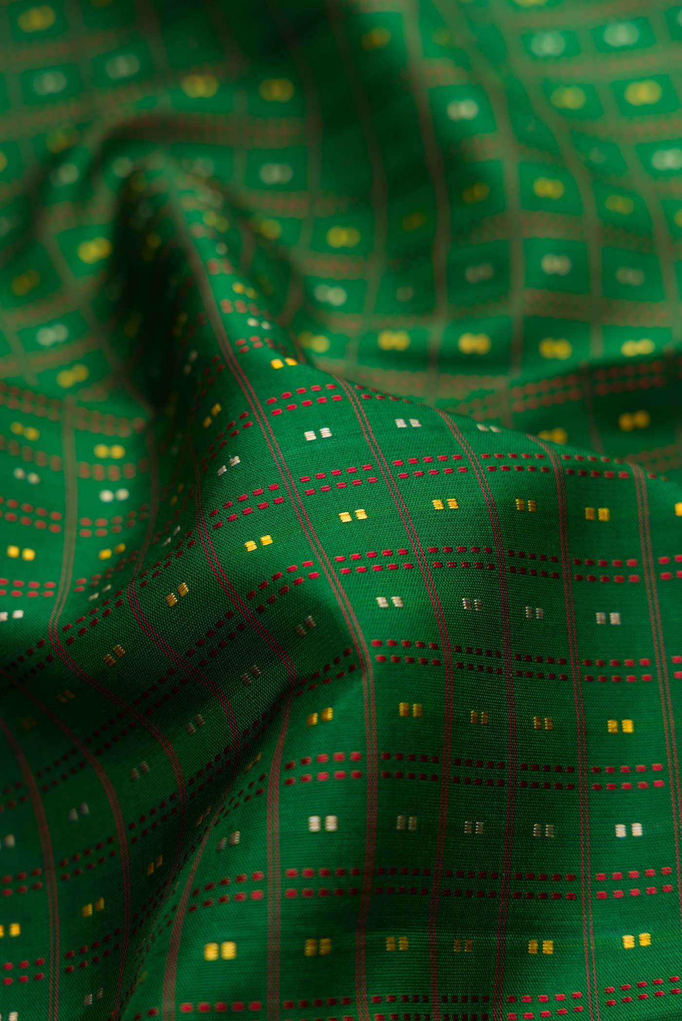 Close up of Bottle Green Dual Tone Kanchipuram Silk Saree with Stripes on the body and Zari Border displaying folds