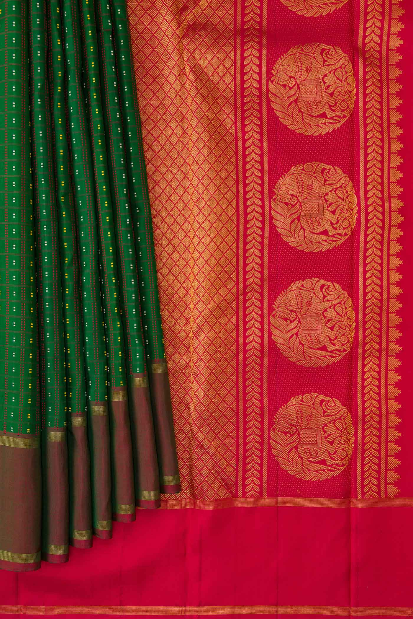 Pleats and pallu of Bottle Green Dual Tone Kanchipuram Silk Saree with Stripes on the body and Zari Border