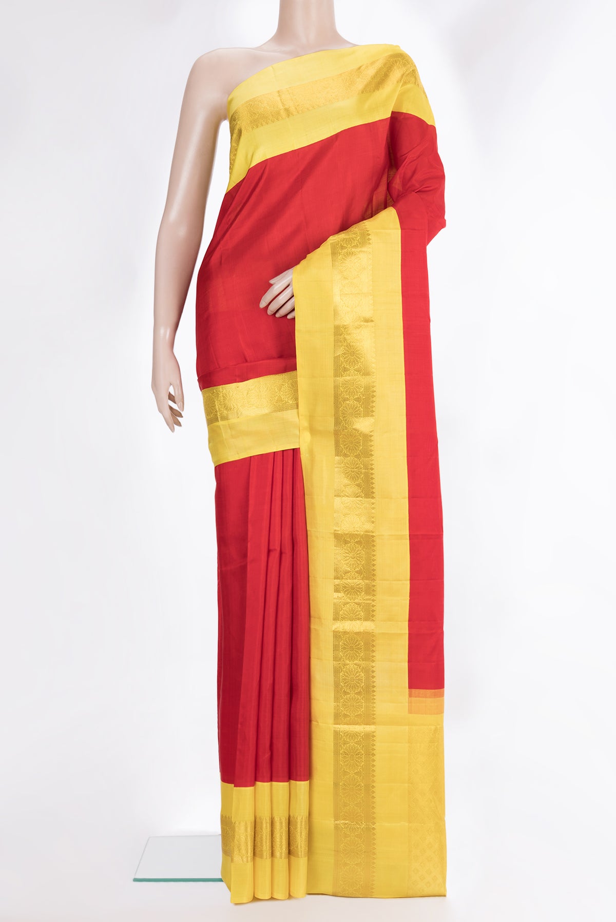Pure Silk Red Kanjivaram Saree with Plain Body and Zari Border.  displayed on a mannequin